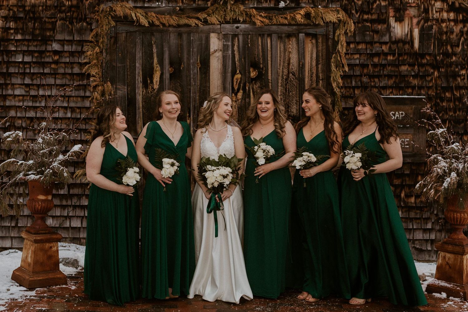 Deirdre and her bridesmaids posing for portraits after the wedding ceremony in Tamworth New Hampshire.