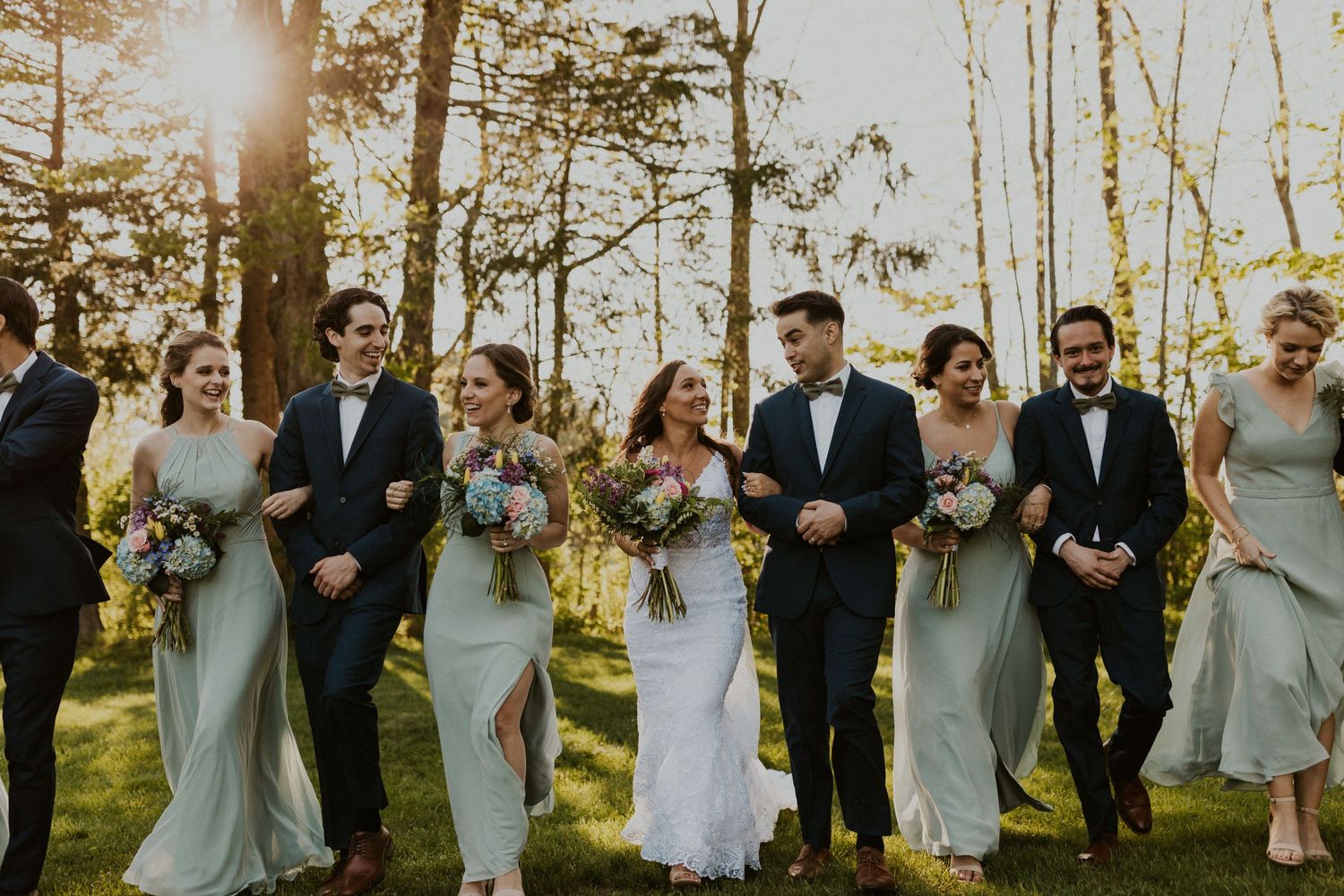 The wedding party is all walking and talking, this photo focuses on the Bride and groom a bit more.