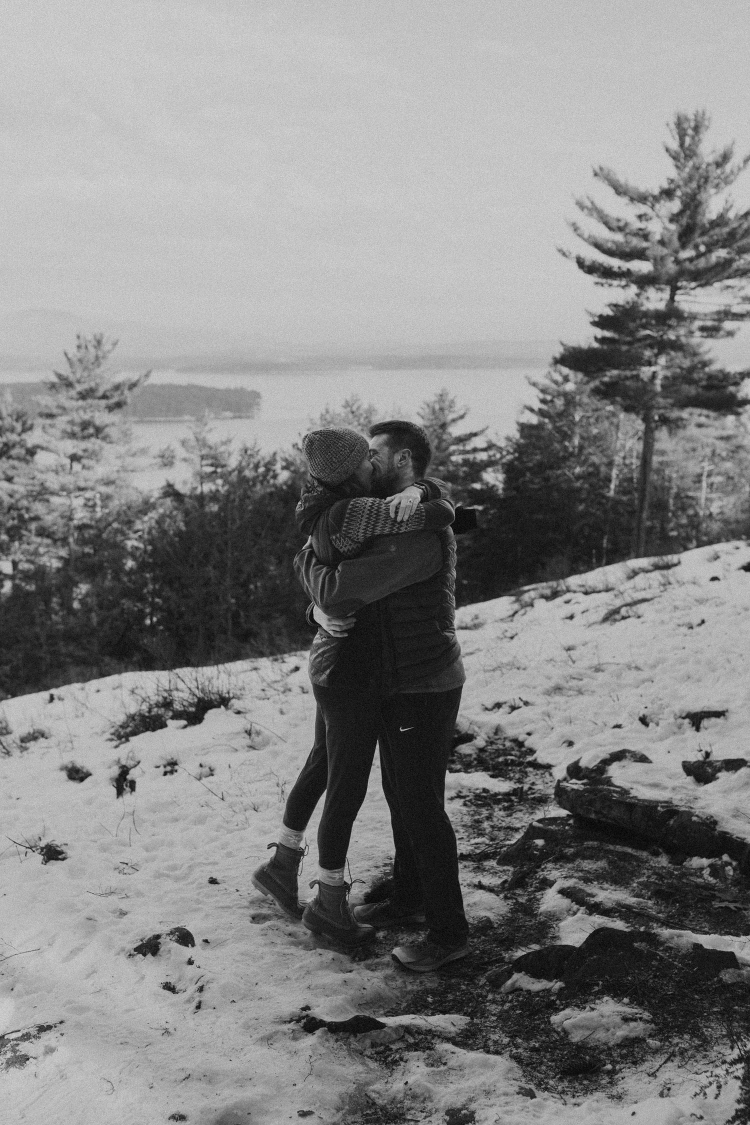 Kirsten hugging onto Ivan after he proposed to her on Lockes Hill Trail in Gilford New Hampshire.