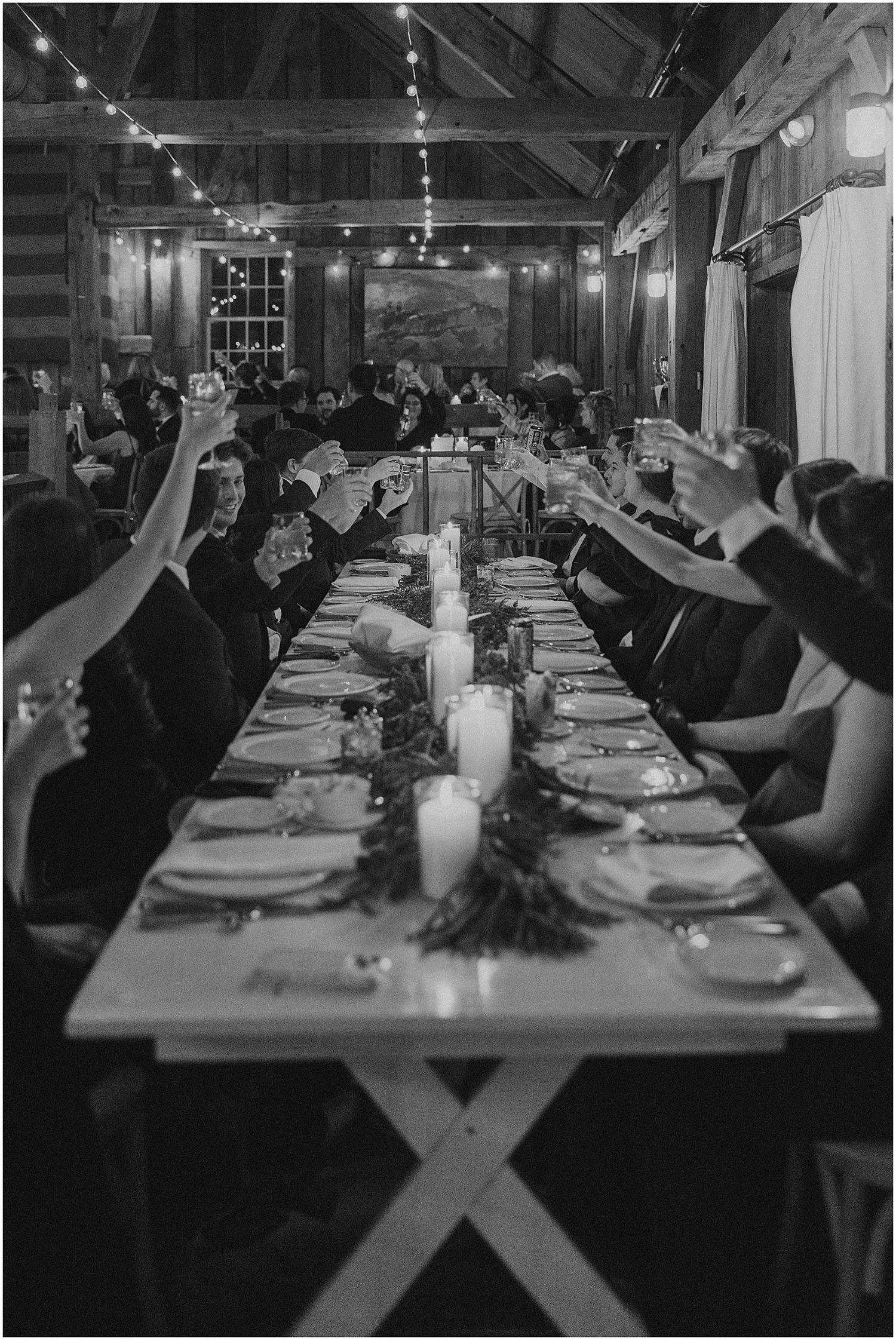 Wedding guests toasting at White Mountain wedding venue Barn on the Pemi