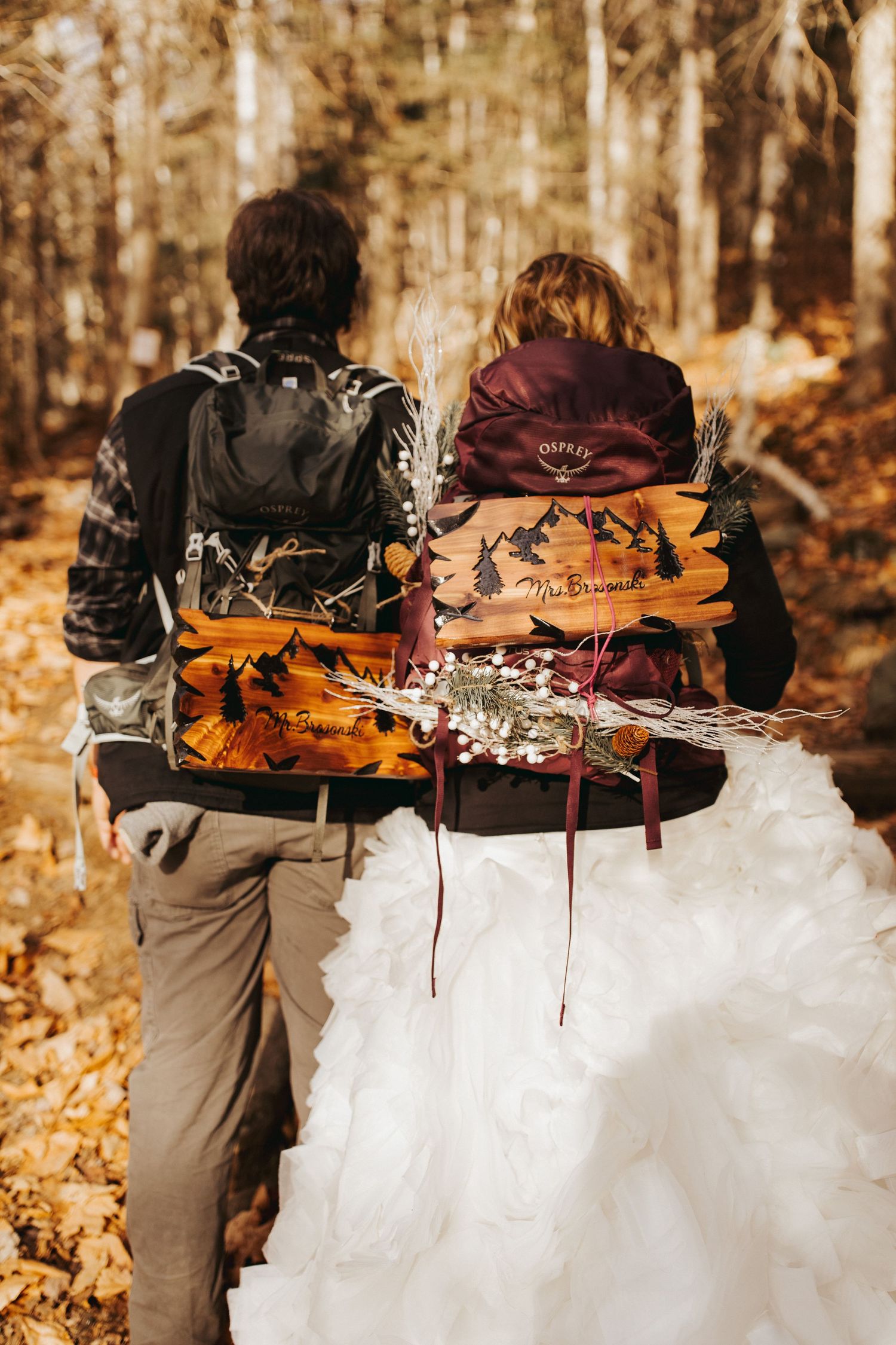 Jackie and Andy Brosonski hike the West Ridge Trail on Mount Cardigan in their wedding attire.