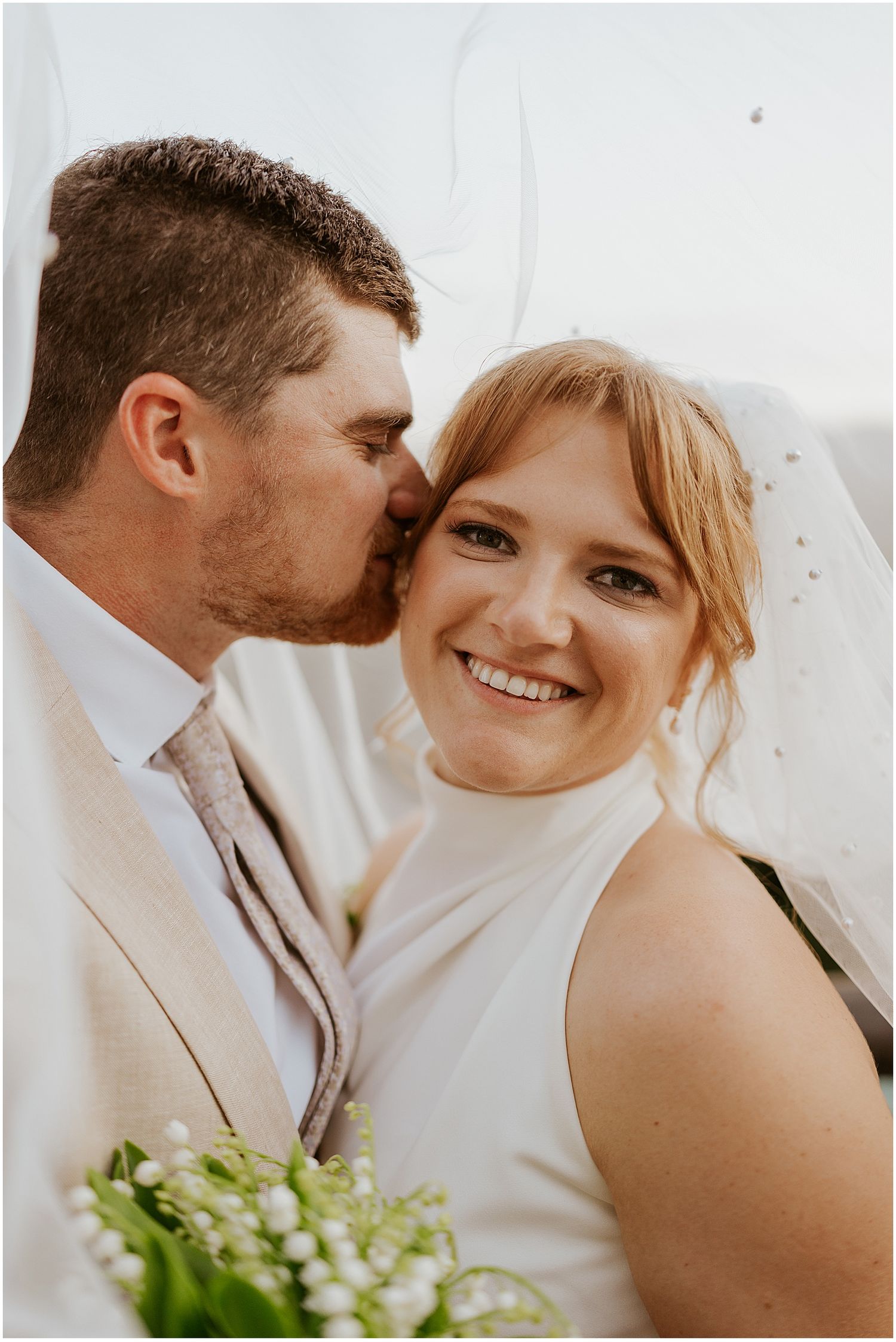 Bride and groom taking portrait photos at their VRBO wedding in Maine