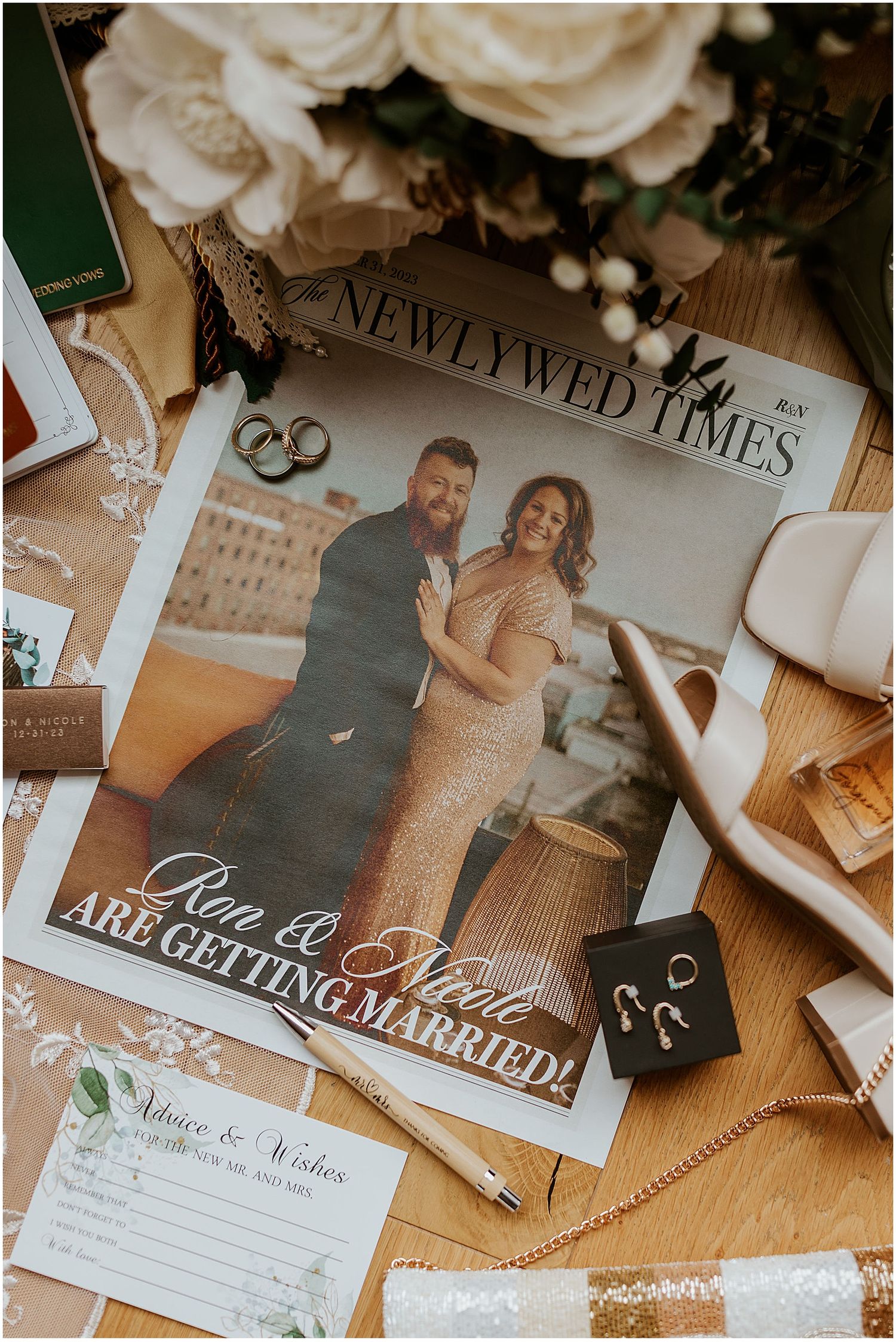 Wedding announcements and photographs displayed with rings and decorative elements.
