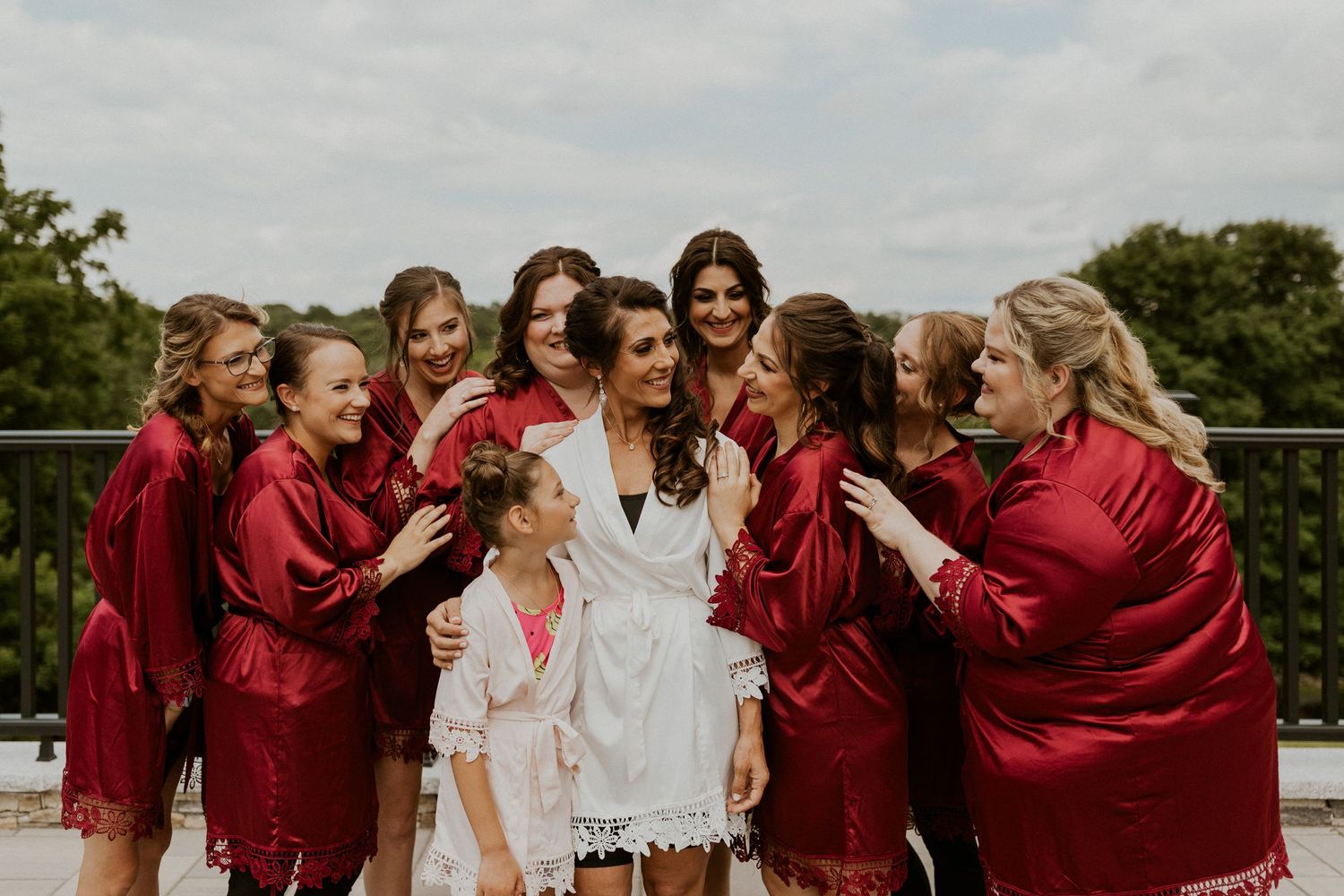 Jessica and her bridesmaids together in their silk matching pajamas.