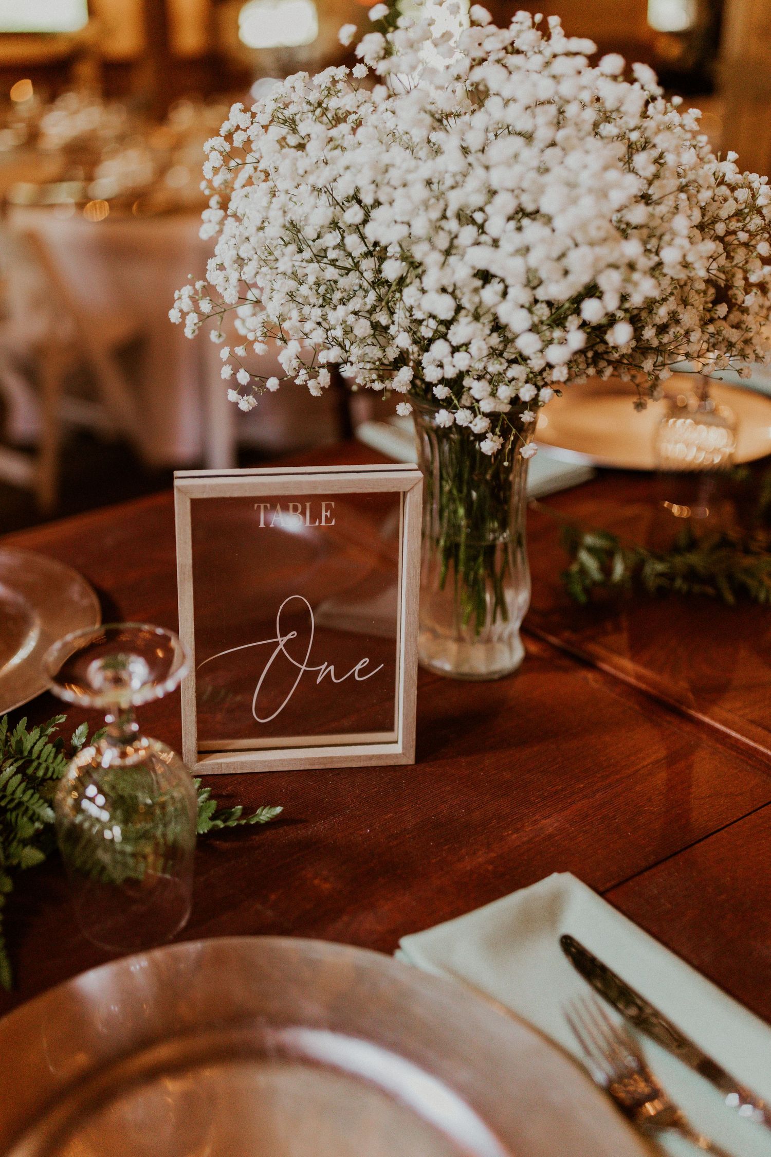 Wedding decor at a rustic barn wedding at the Arabella Estate in Buxton Maine.
