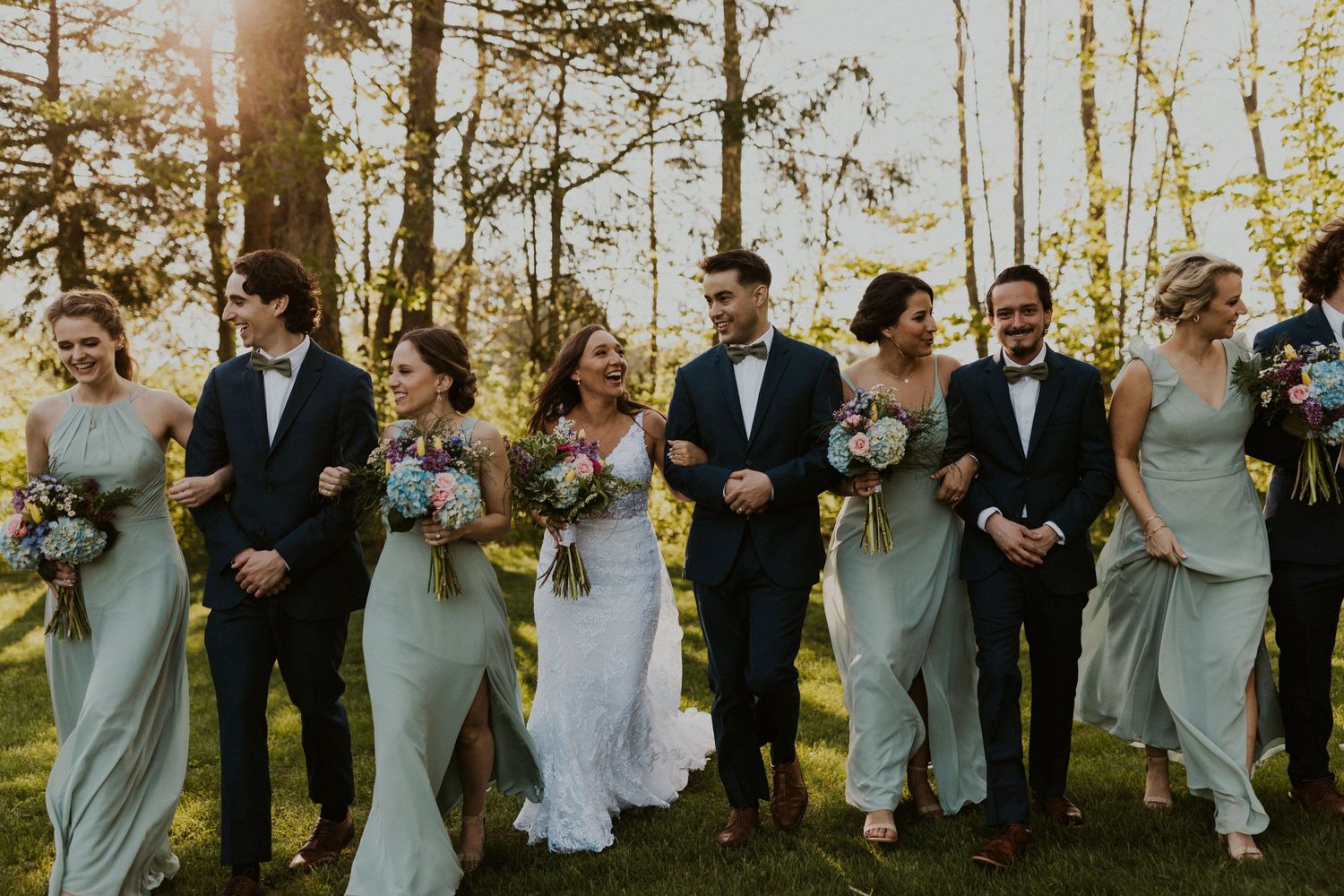 The wedding party is all walking and talking, this photo focuses on the Bride and groom a bit more.
