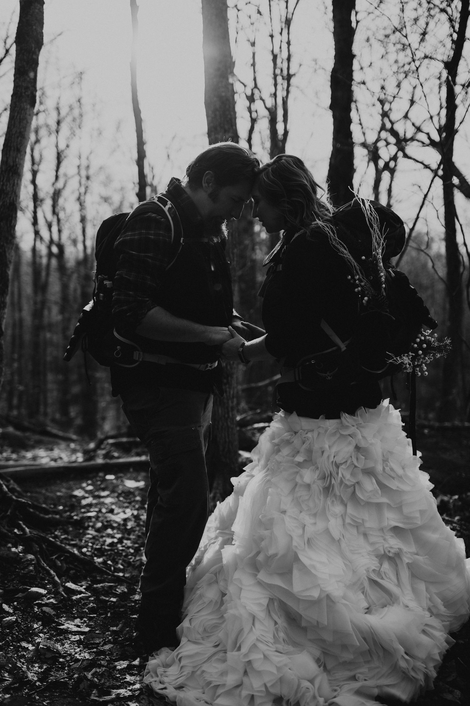 Jackie and Andy Brosonski hike the West Ridge Trail on Mount Cardigan in their wedding attire.