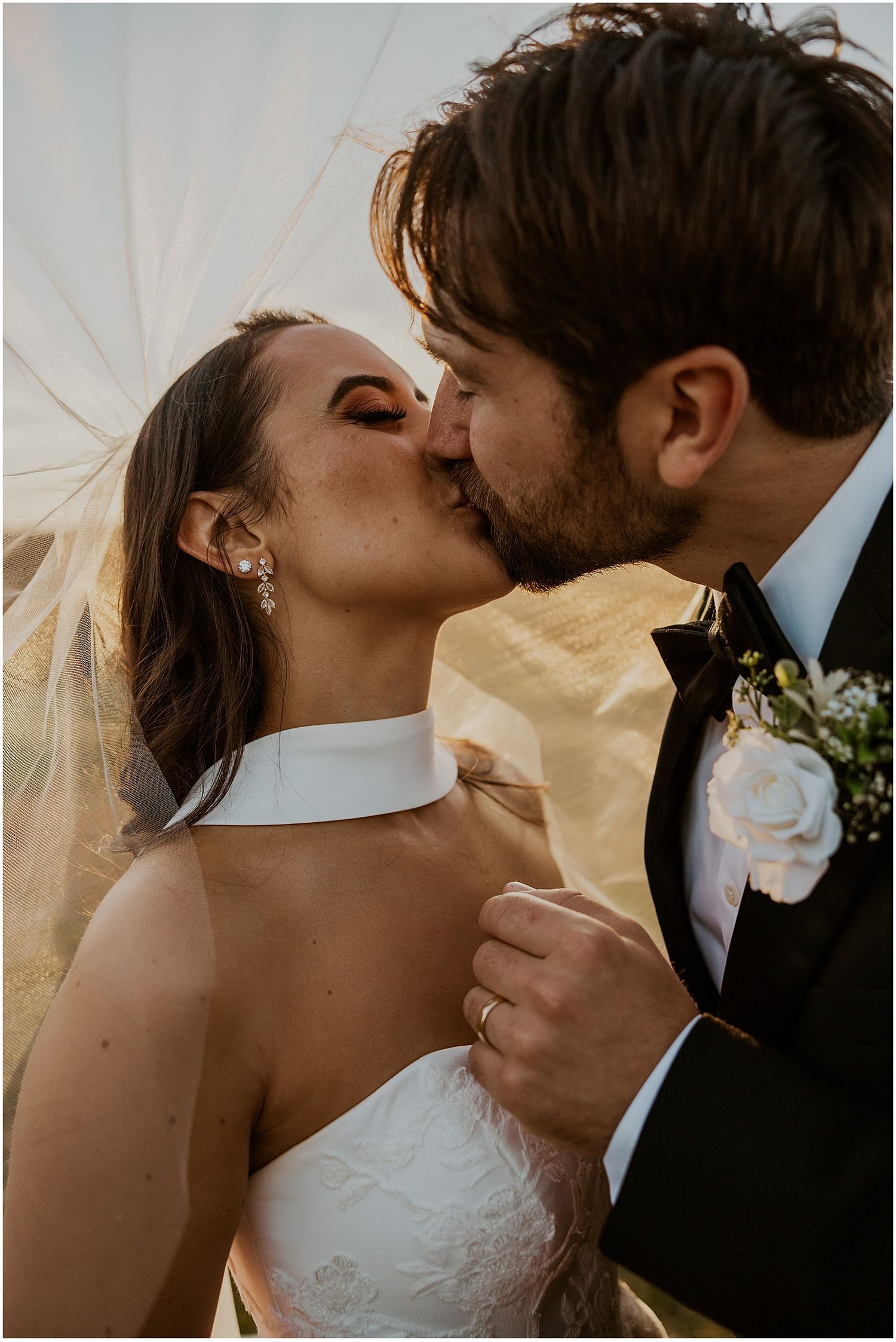 Bride and groom taking golden hour wedding portraits