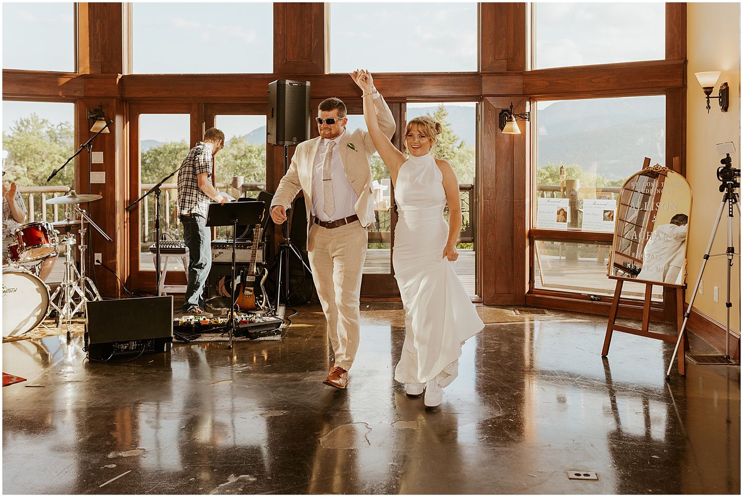 Bride and groom entering their reception at their Maine wedding