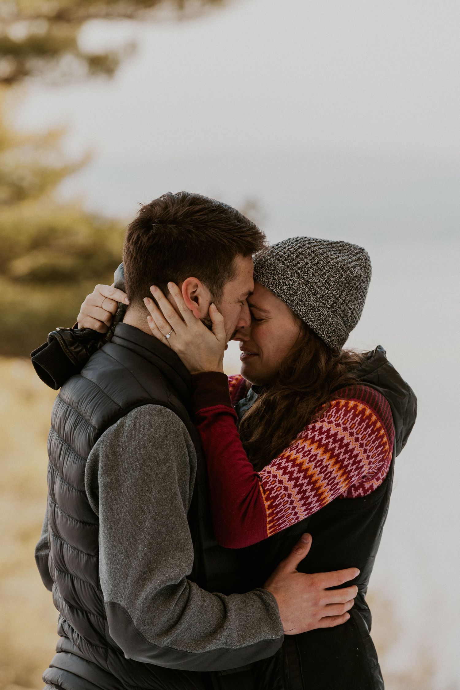 Kirsten hugging onto Ivan after he proposed to her on Lockes Hill Trail in Gilford New Hampshire.