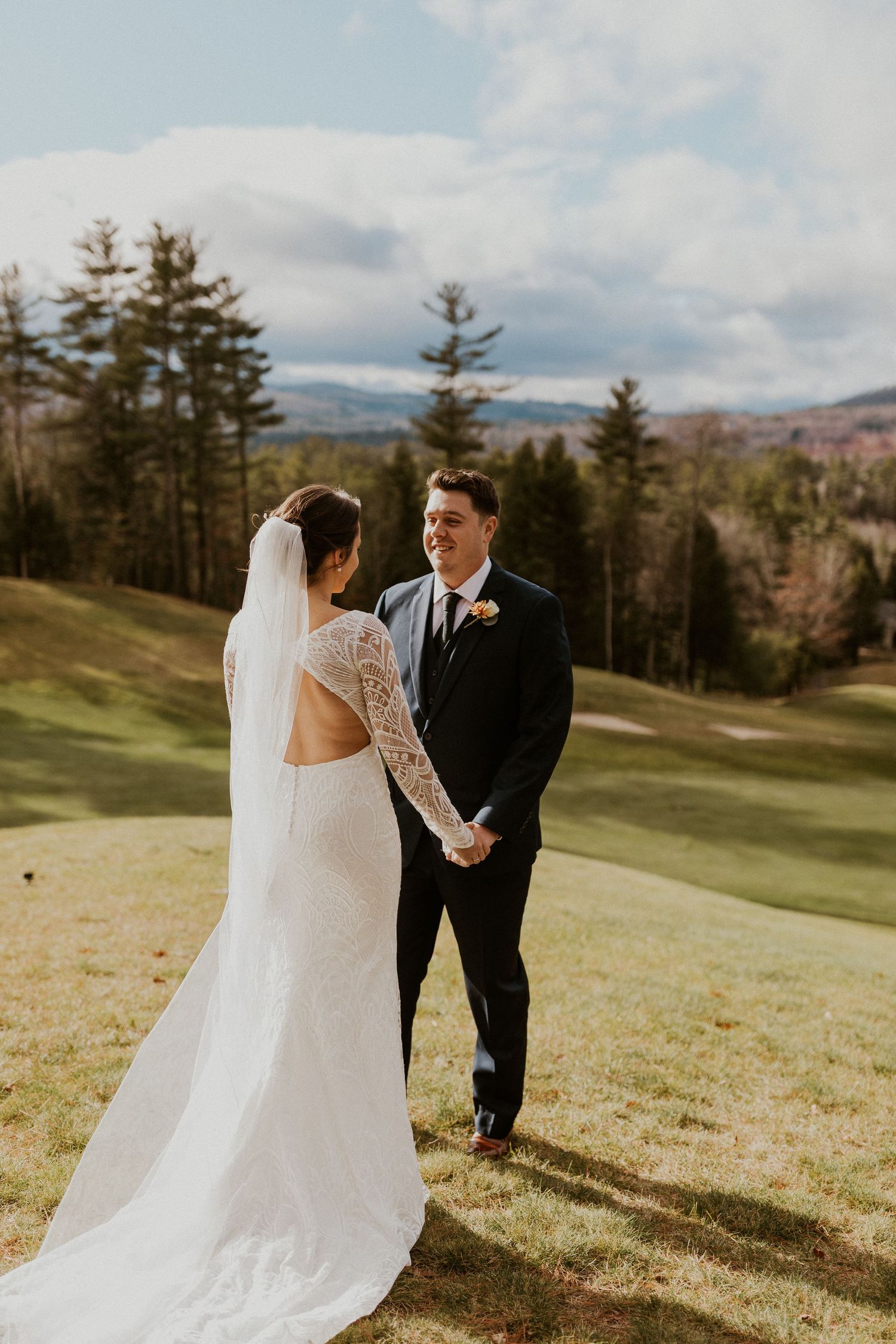 First look shared between bride and groom at the Owl's Nest Resort in Thornton, New Hampshire.