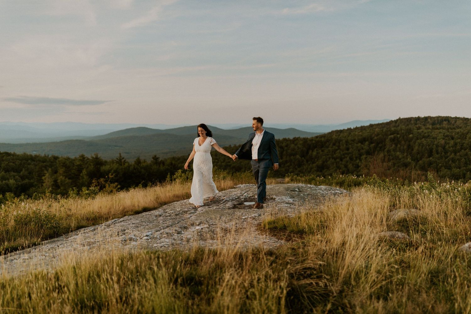 Danielle and Colin dressed in their wedding attire for their one year anniversary photoshoot on Foss Mountain in NH.