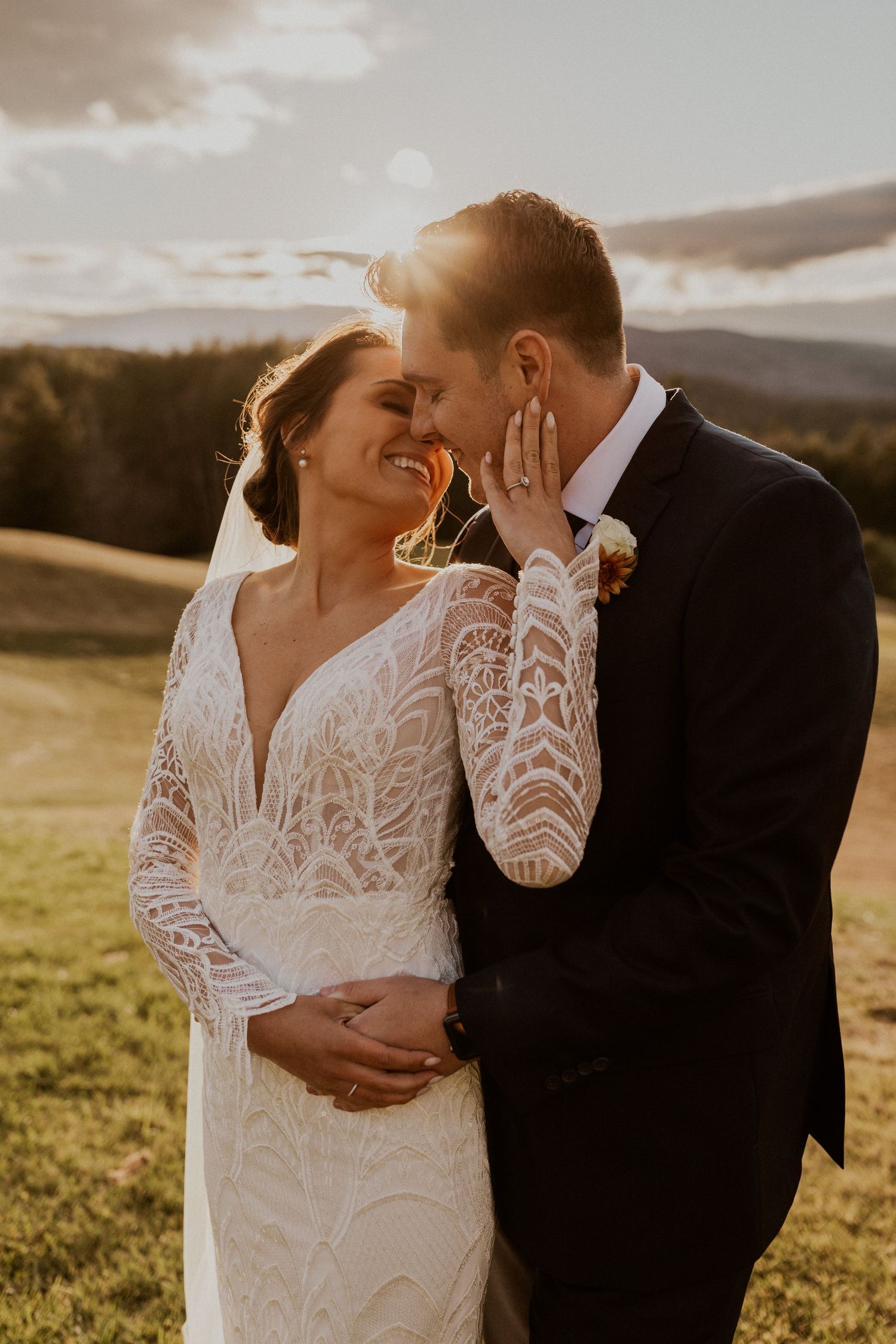 Bride and groom holding each other intimately during portraits at Owl's Nest Resort in Thornton, New Hampshire.