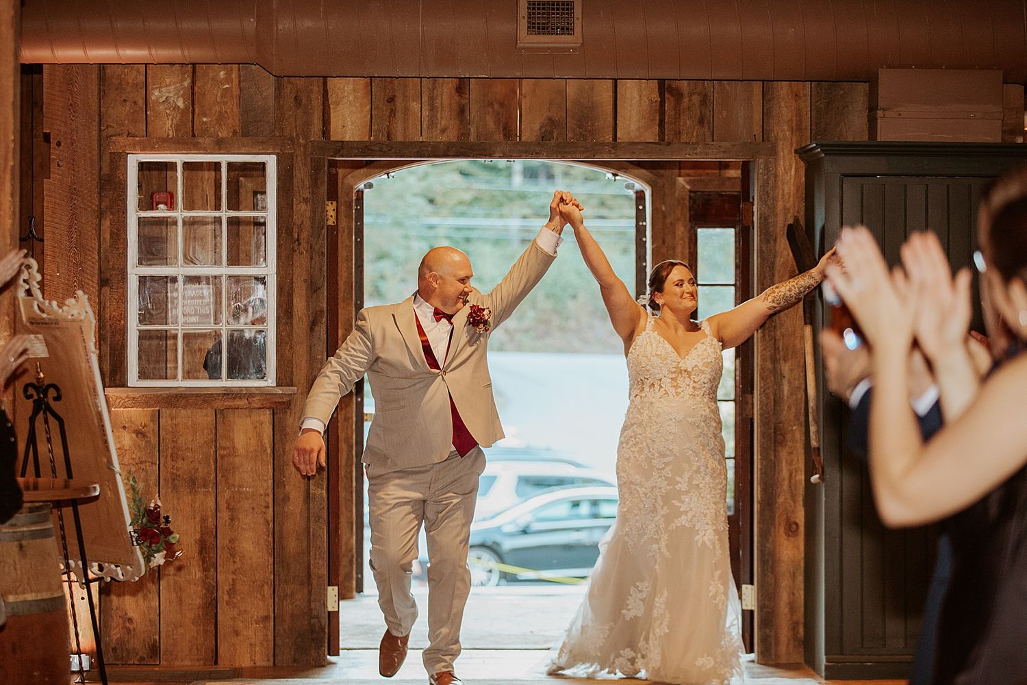 Bride and groom entering their reception at their New Hampshire wedding