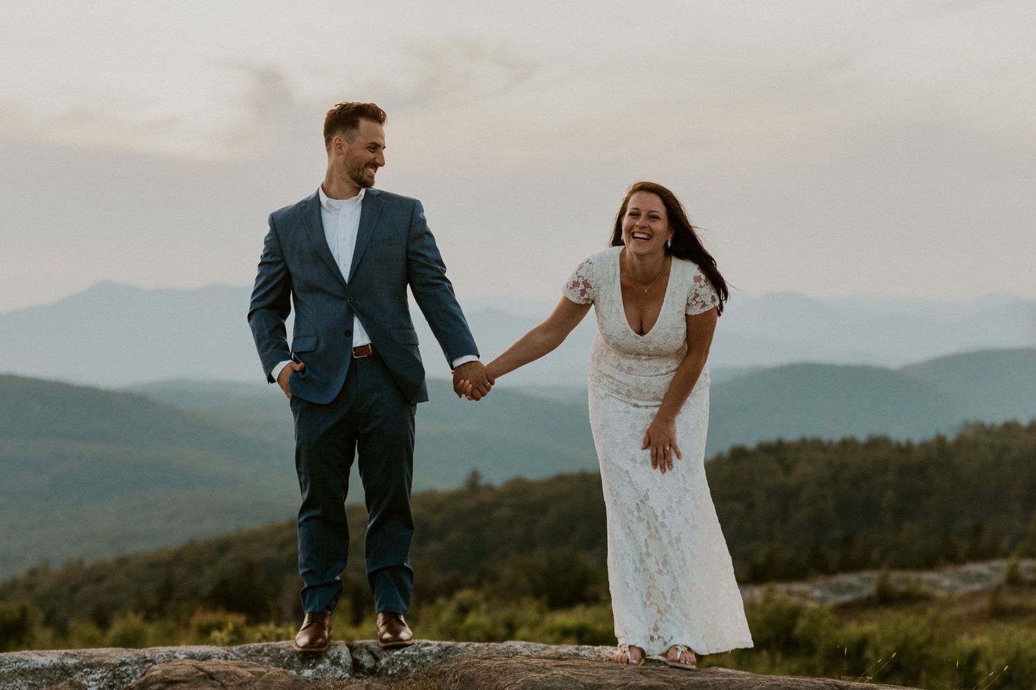 Danielle and Colin dressed in their wedding attire for their one year anniversary photoshoot on Foss Mountain in NH.