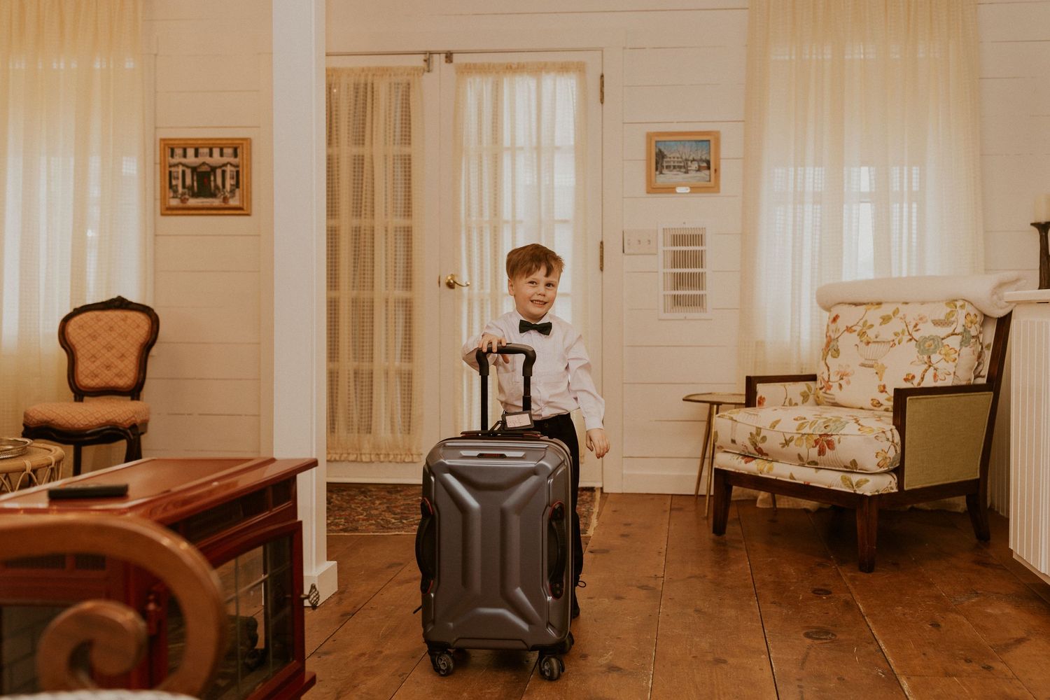 Deirdre's nephew Colby playing with the luggage while everyone was getting ready for the wedding.