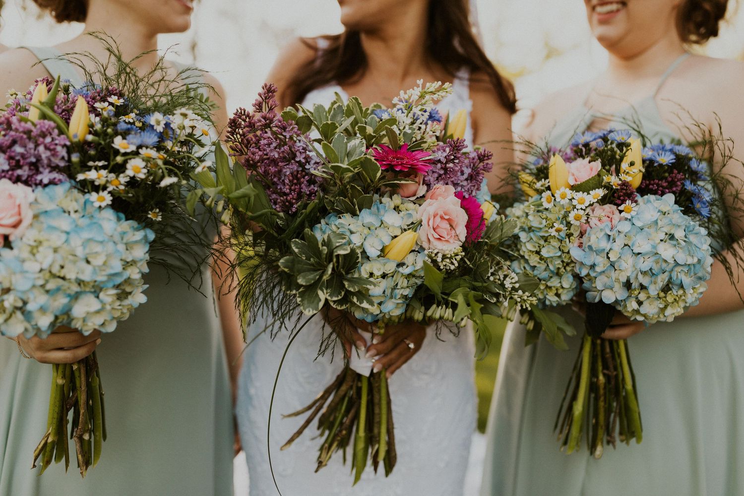 A beautiful detailed photograph of the wedding bouquets made by Little River Flower Farm.