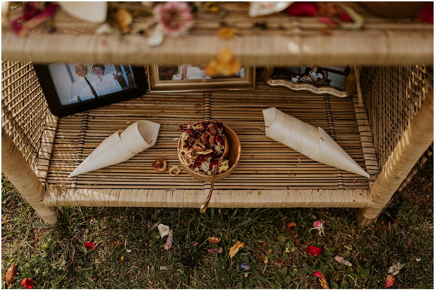 Rustic wooden deck decorated with autumn leaves and wedding decor.