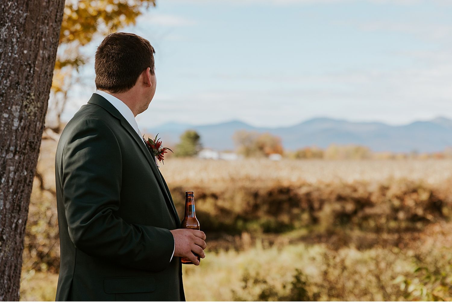 Groom waiting to take first look wedding photos