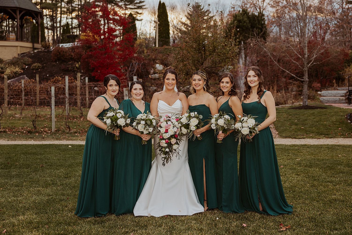 Bride and her bridesmaids in green dresses for a New Hampshire wedding