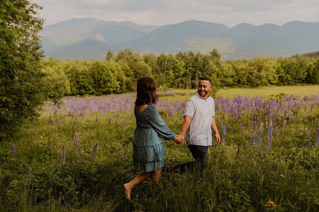 NH engagement pictures in lupine field