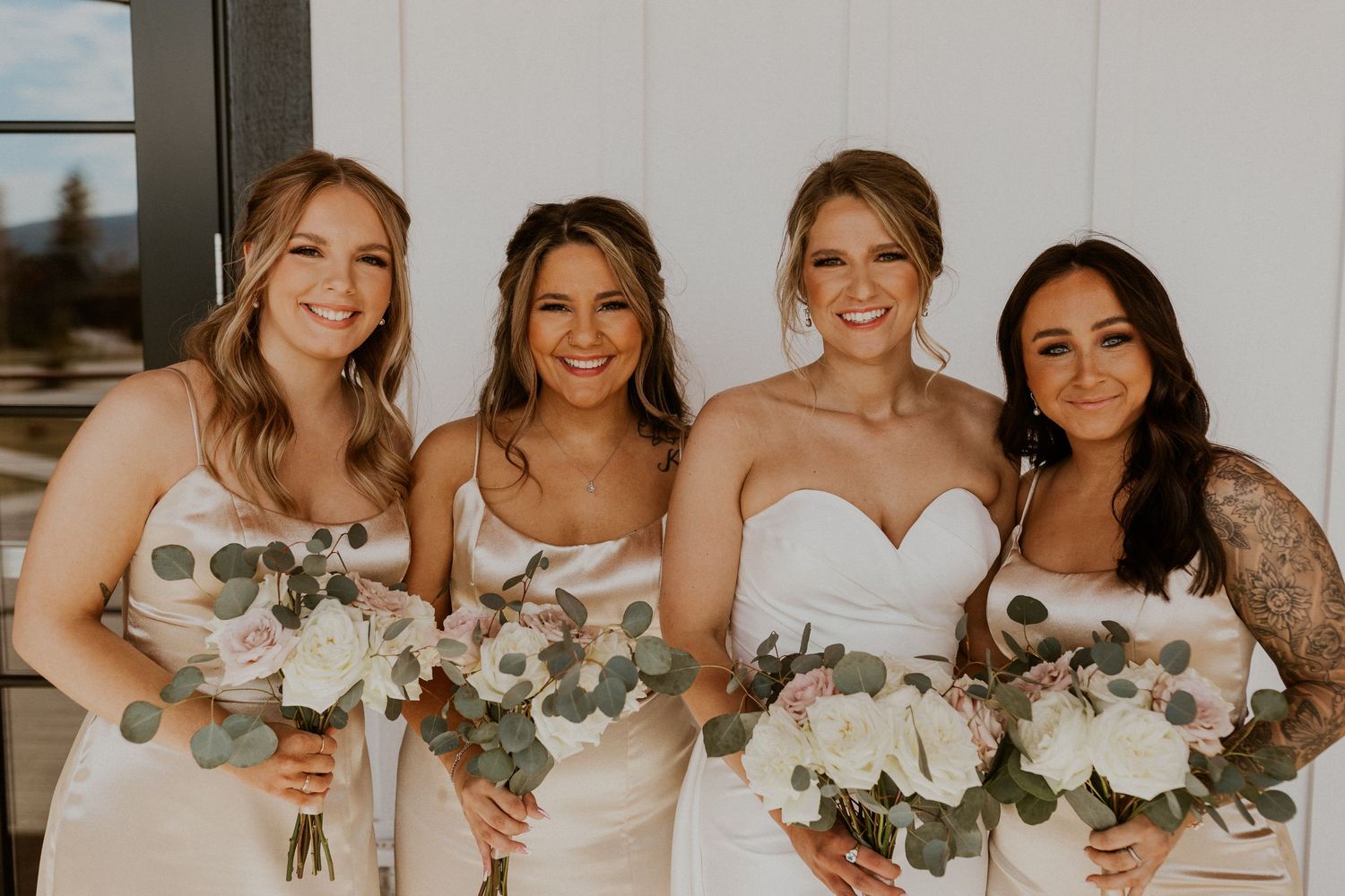 Bridesmaid photos of Kendra and her girls on the Lake House balcony at Owl's Nest Resort in Thornton New Hampshire