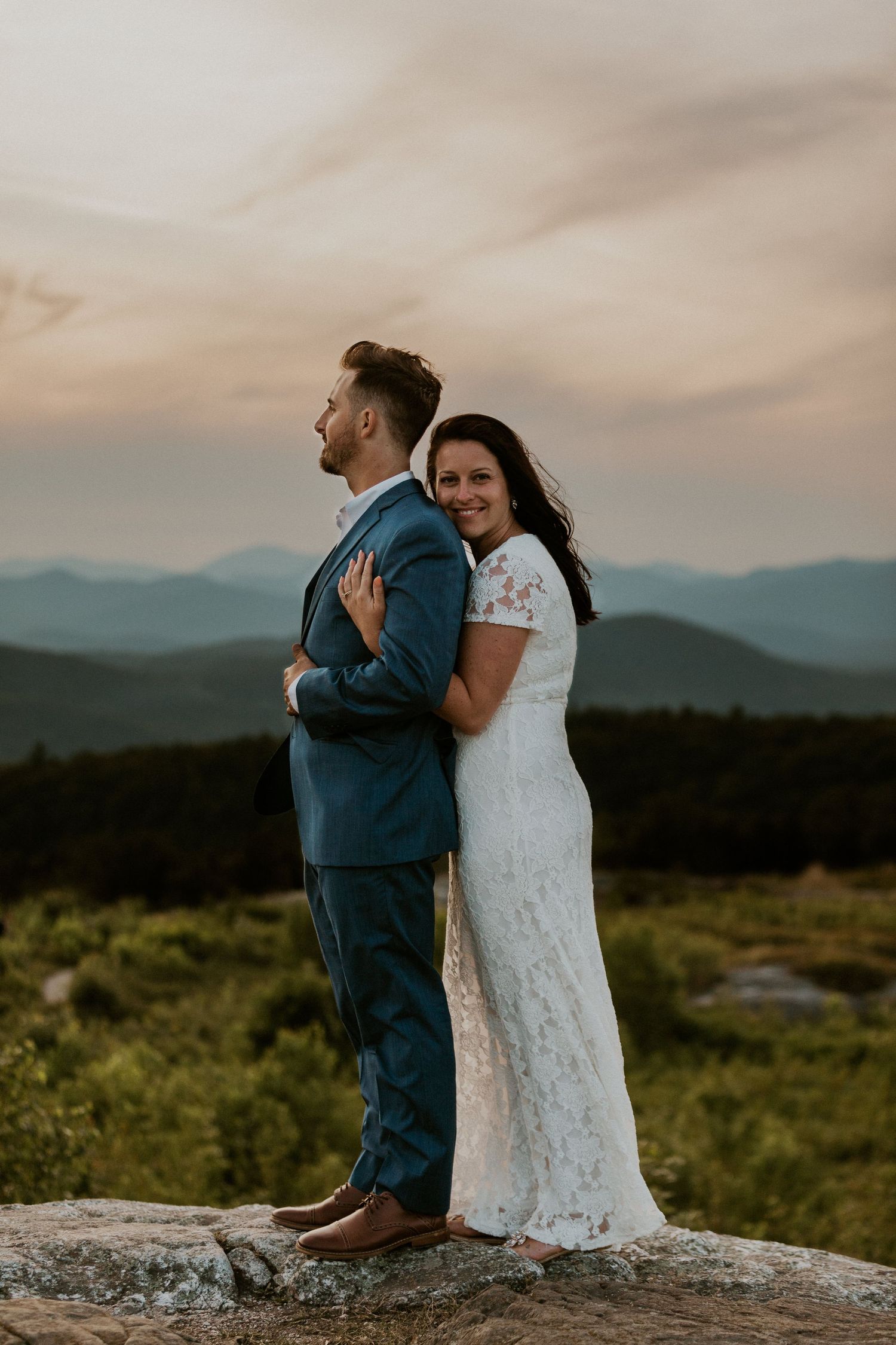 Danielle and Colin dressed in their wedding attire for their one year anniversary photoshoot on Foss Mountain in NH.