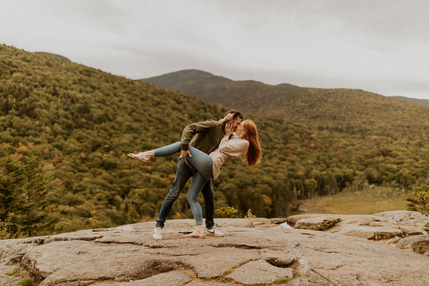 Colin dipping and kissing Sam on the mountain top in crawford notch of the white mountains.