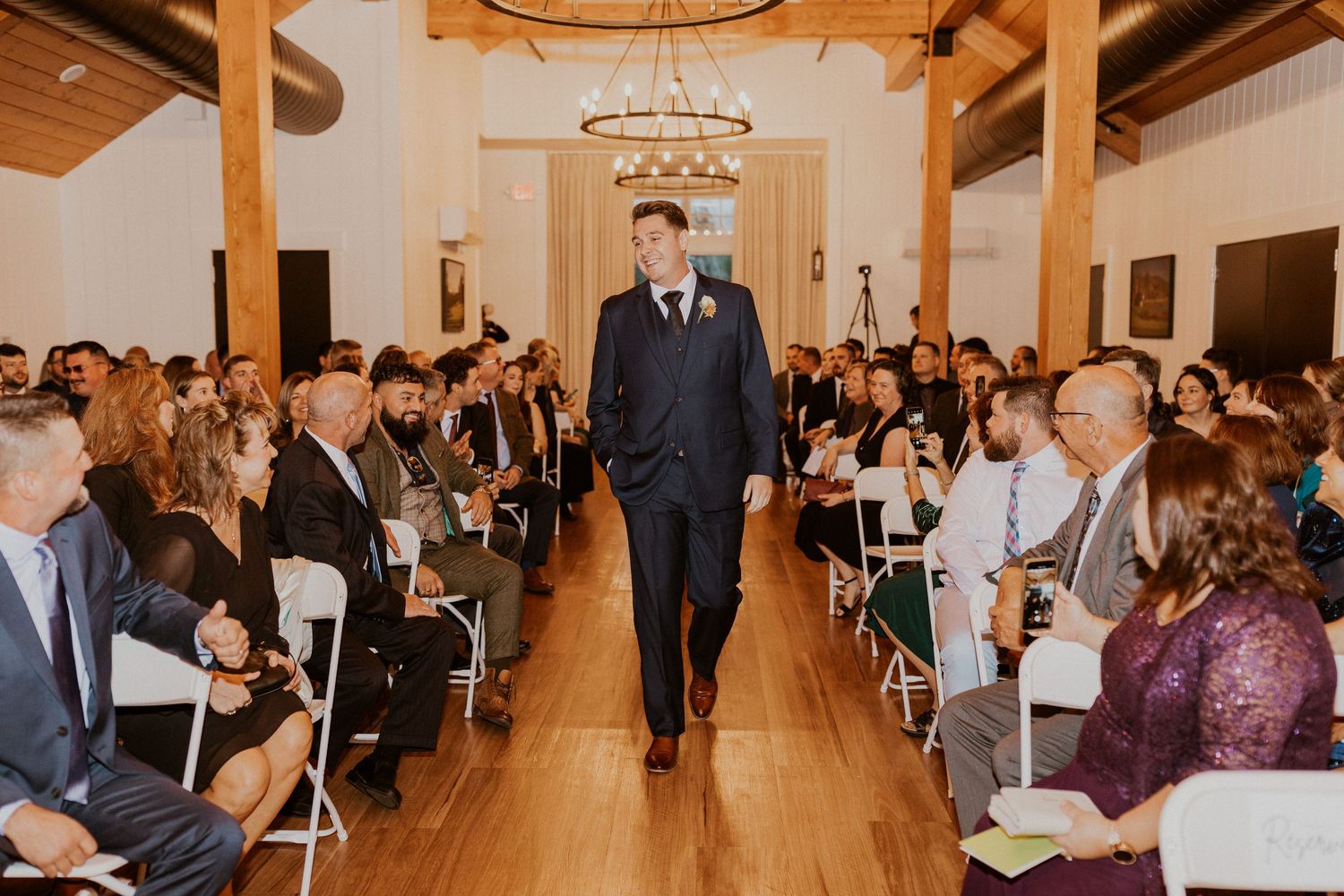 the groom walking into the ceremony