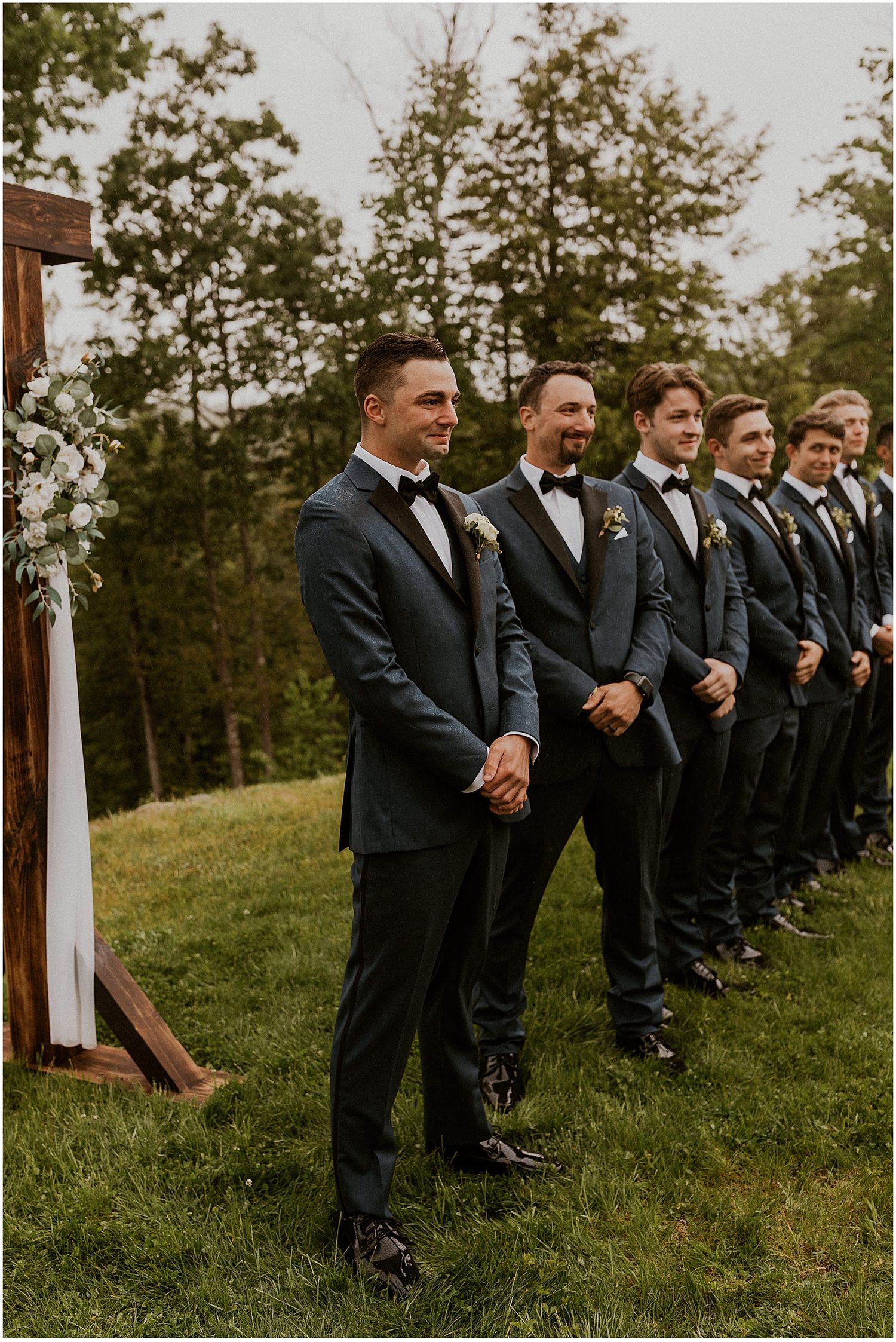 Groom and groomsmen at outdoor NH rainy wedding ceremony