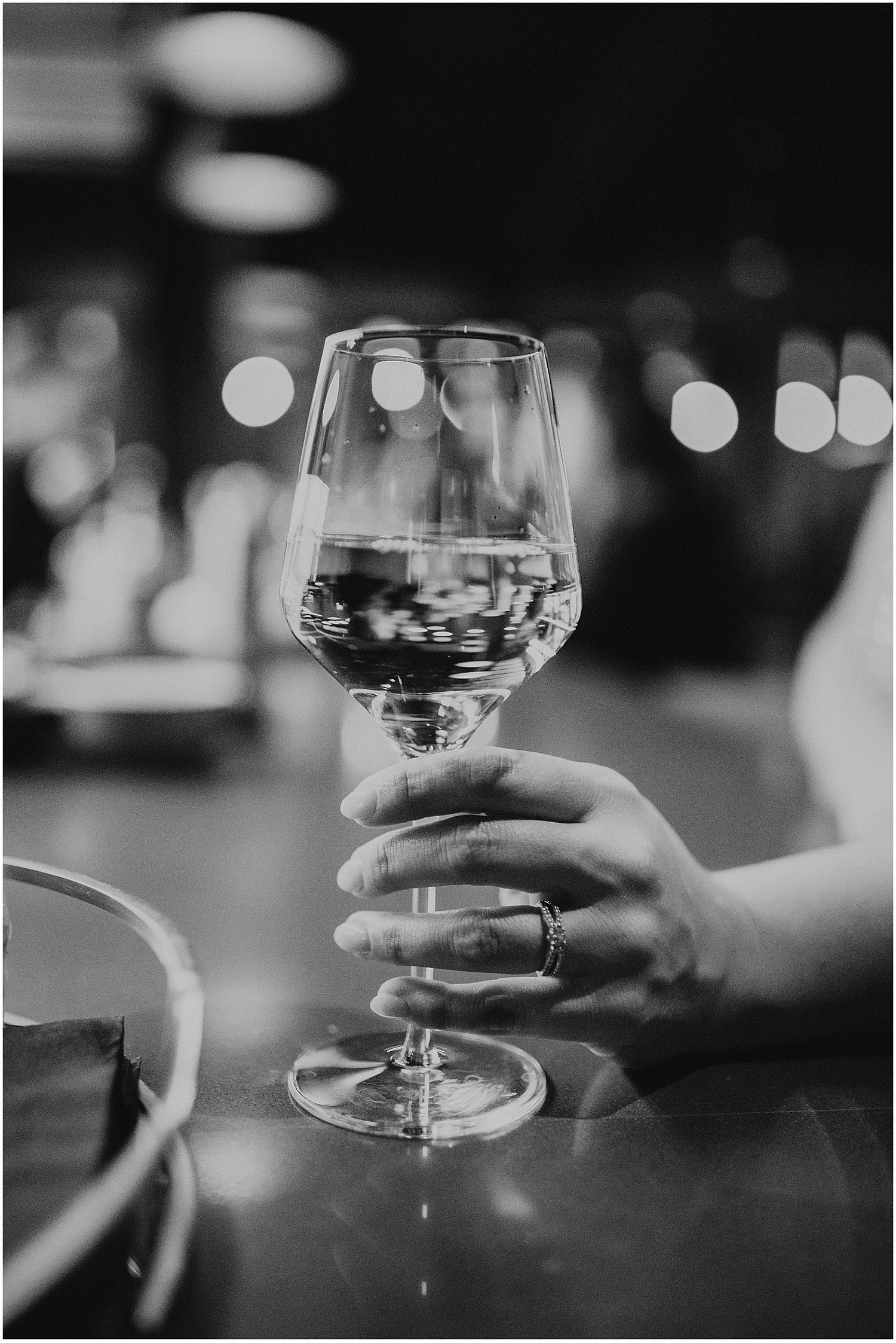 NH woman having a glass of wine during her Portland ME engagement photos