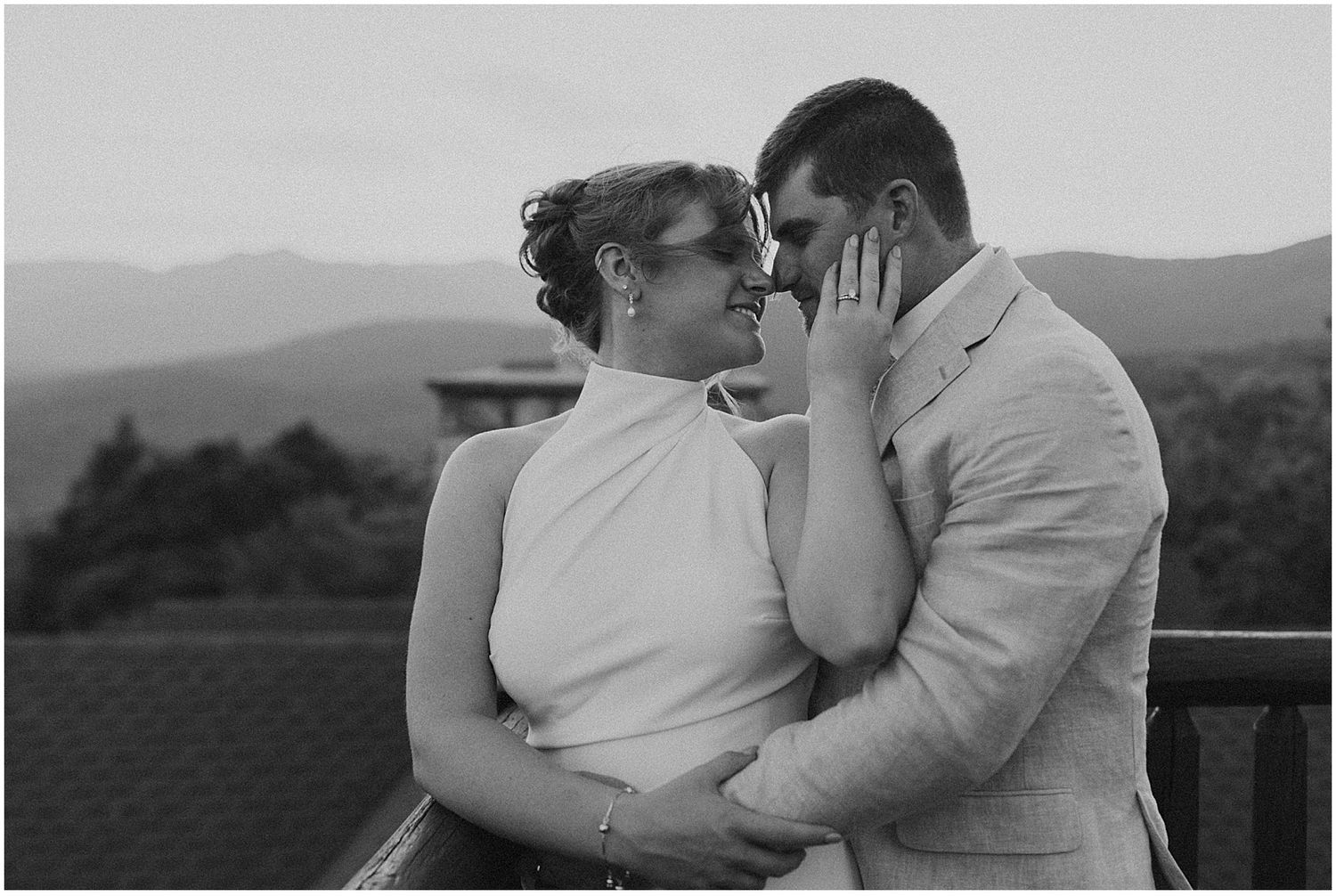 Bride and groom taking portrait photos at their VRBO wedding in the mountains in Maine