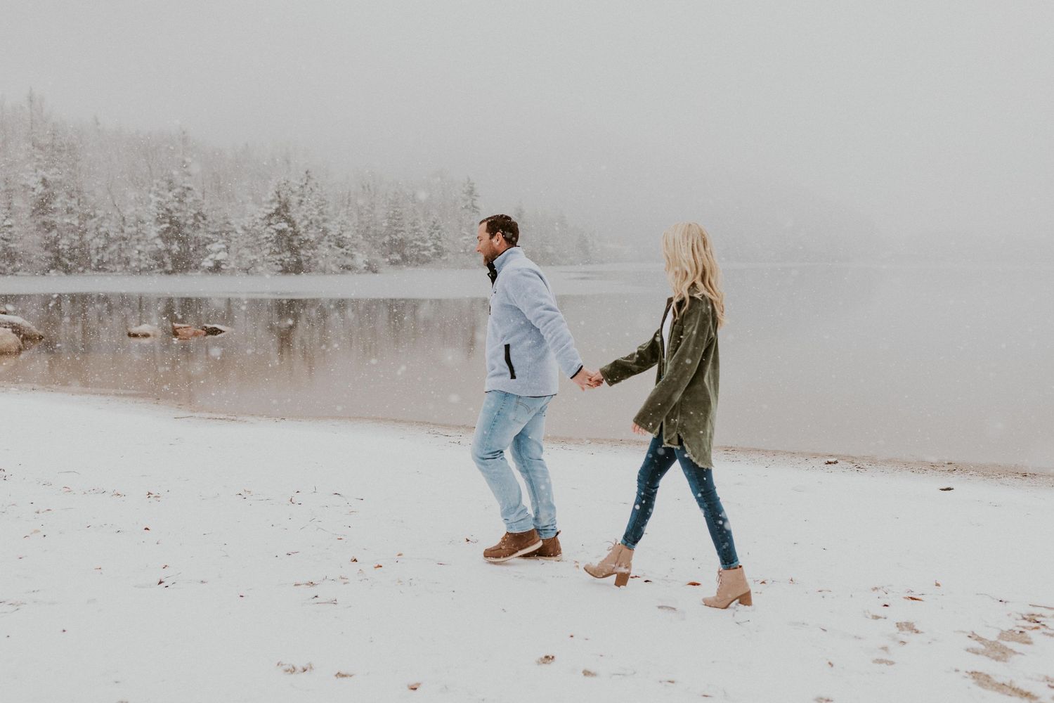 Newly engaged couple playfully posing for photos during their engagement session in Franconia New Hampshire.