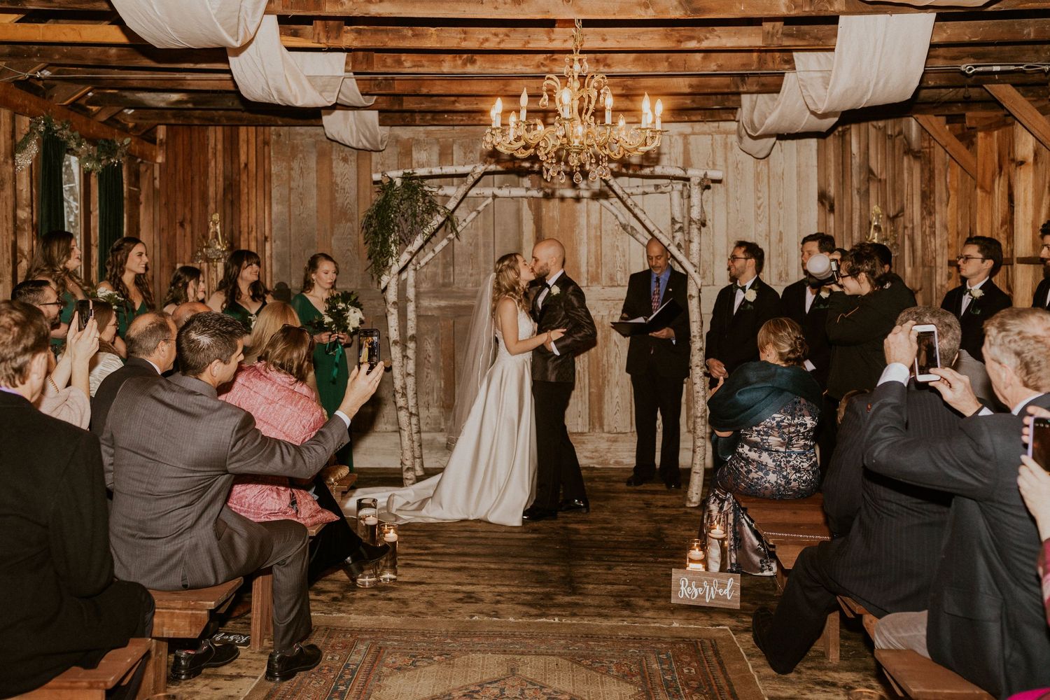 Deirdre and Brodie sealing their marriage with a kiss at their wedding at The Preserve in Tamworth New Hampshire.
