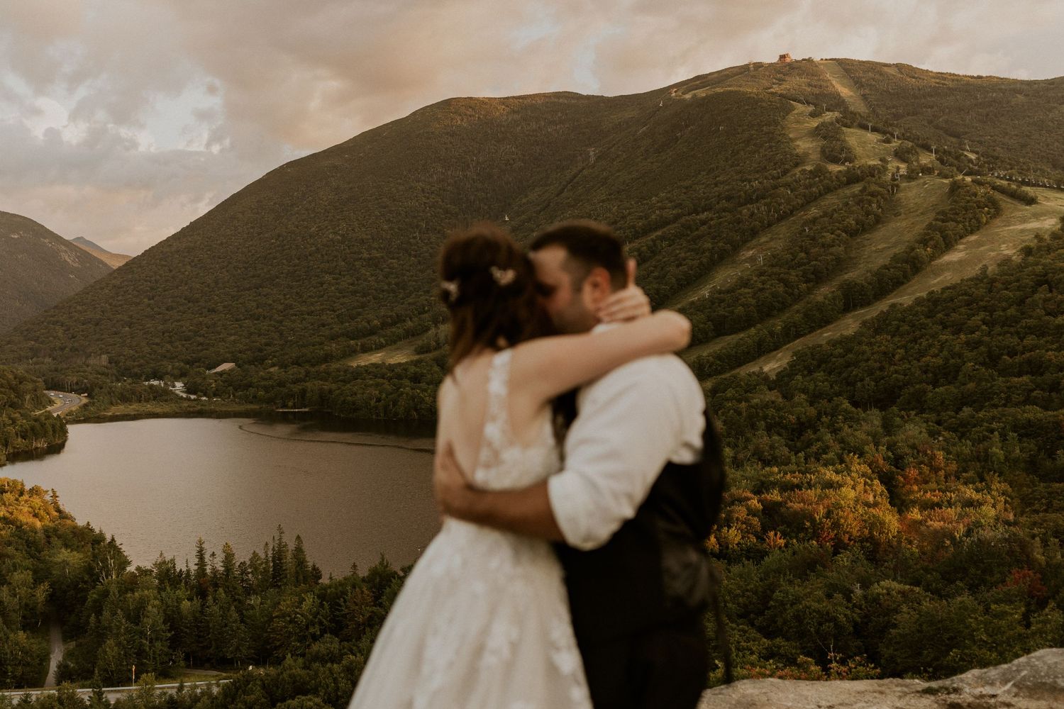 Newlyweds embracing each other and taking in the view on their wedding day,