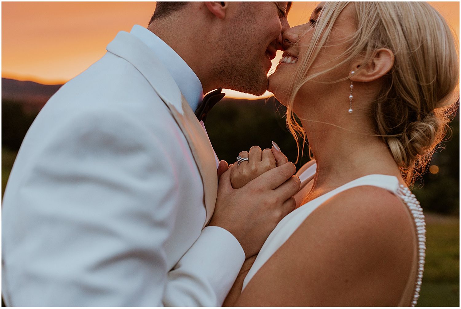Bride and groom taking sunset portrait photos at the Owl's Nest Resort