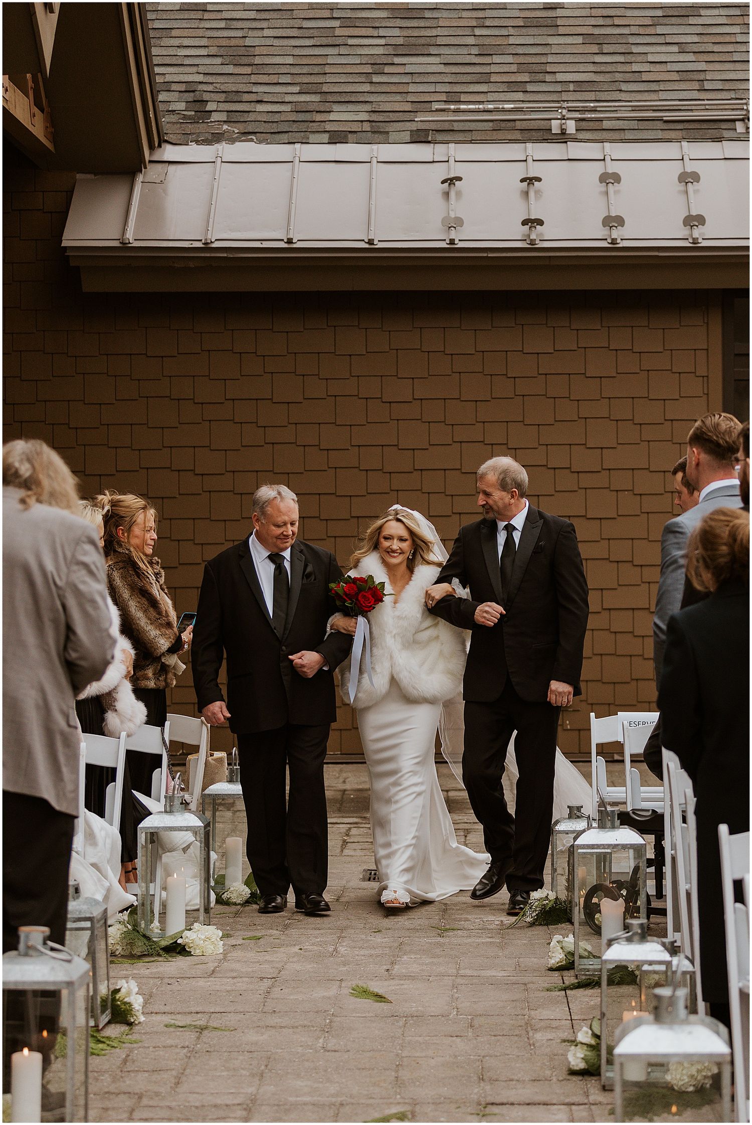 Bride walking down the aisle at her winter wedding