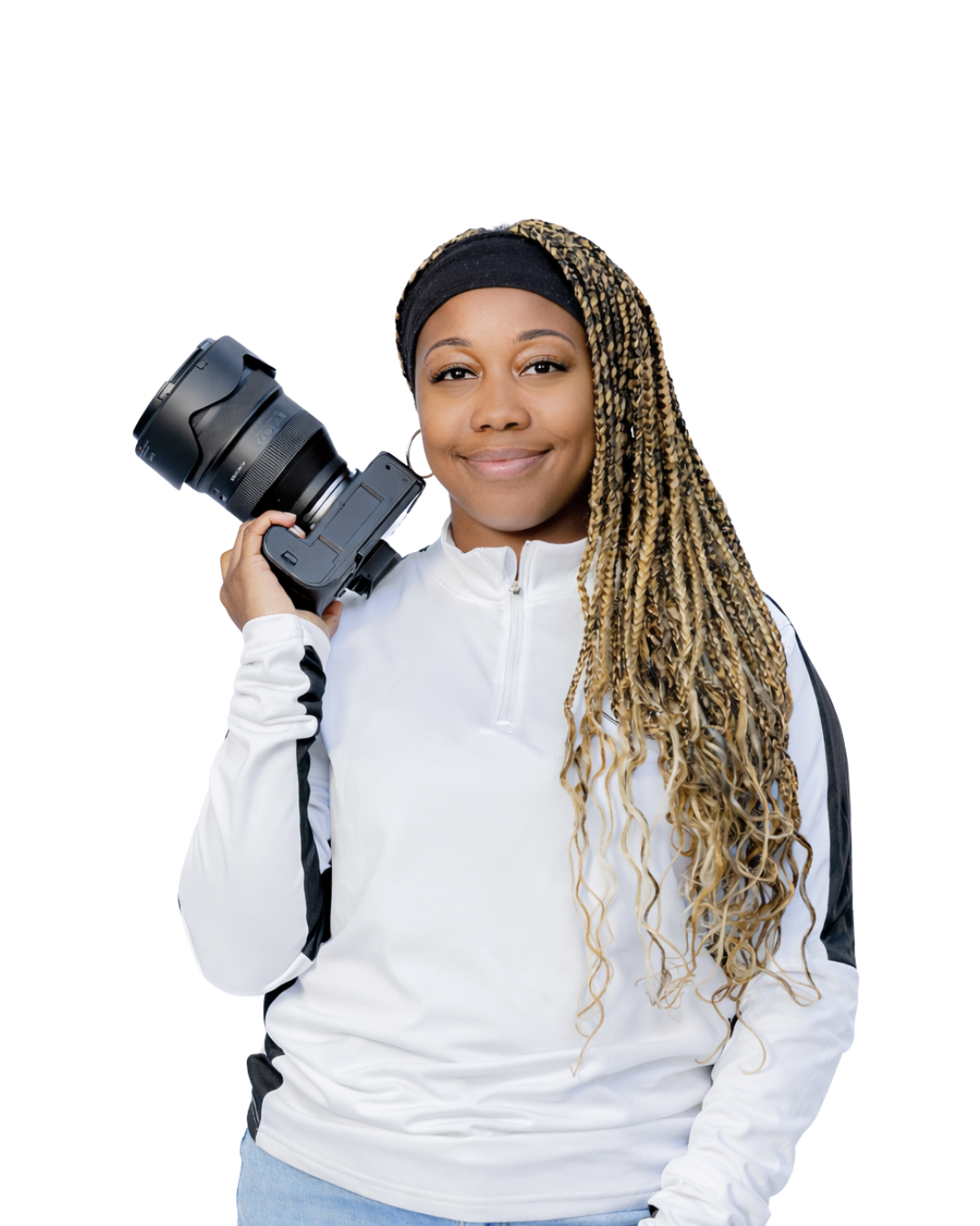 Smiling female photographer with braided hair holding camera on shoulder on white background.
