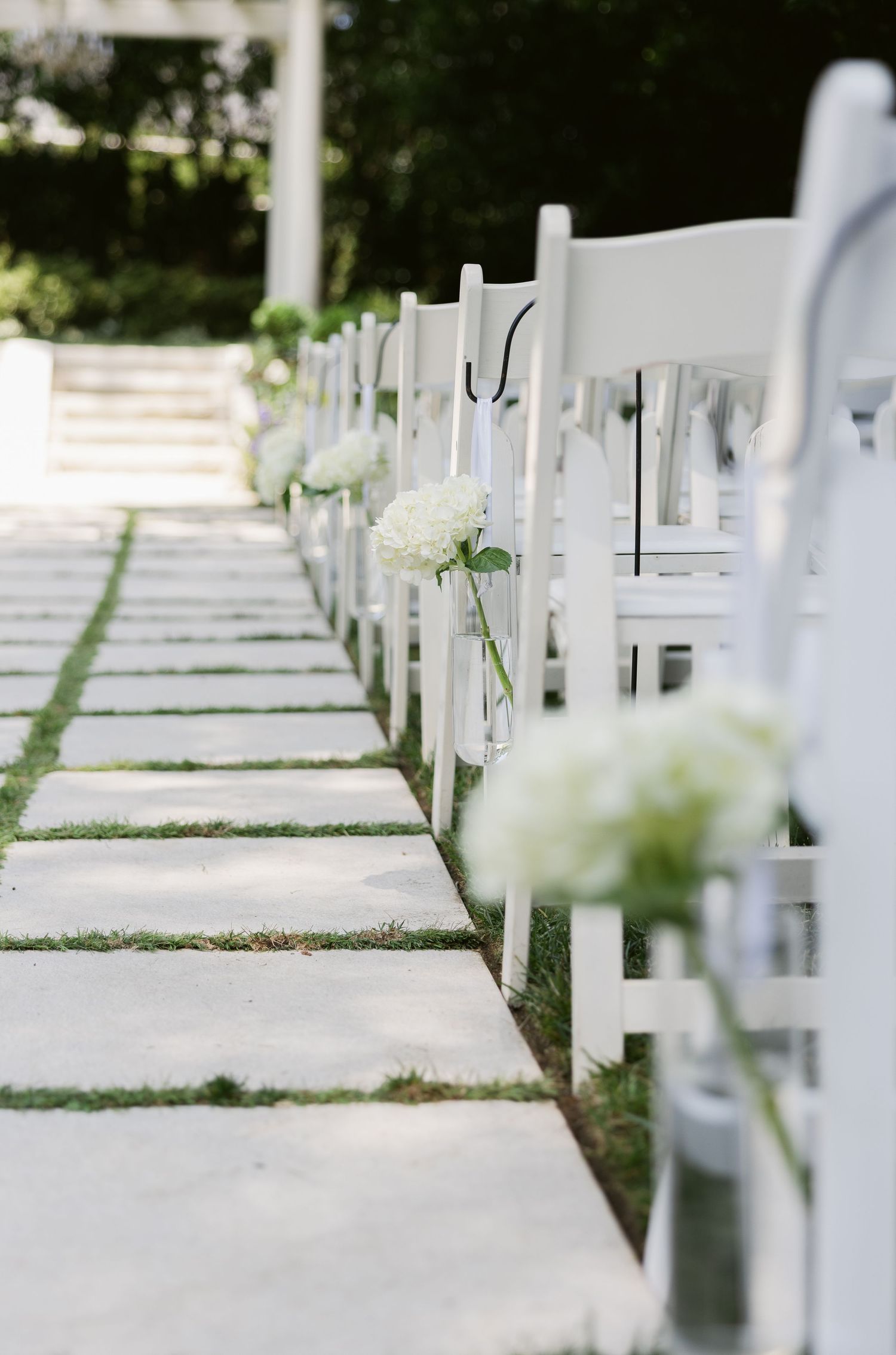 Rows of white crosses marking graves in a memorial cemetery with soft natural lighting.