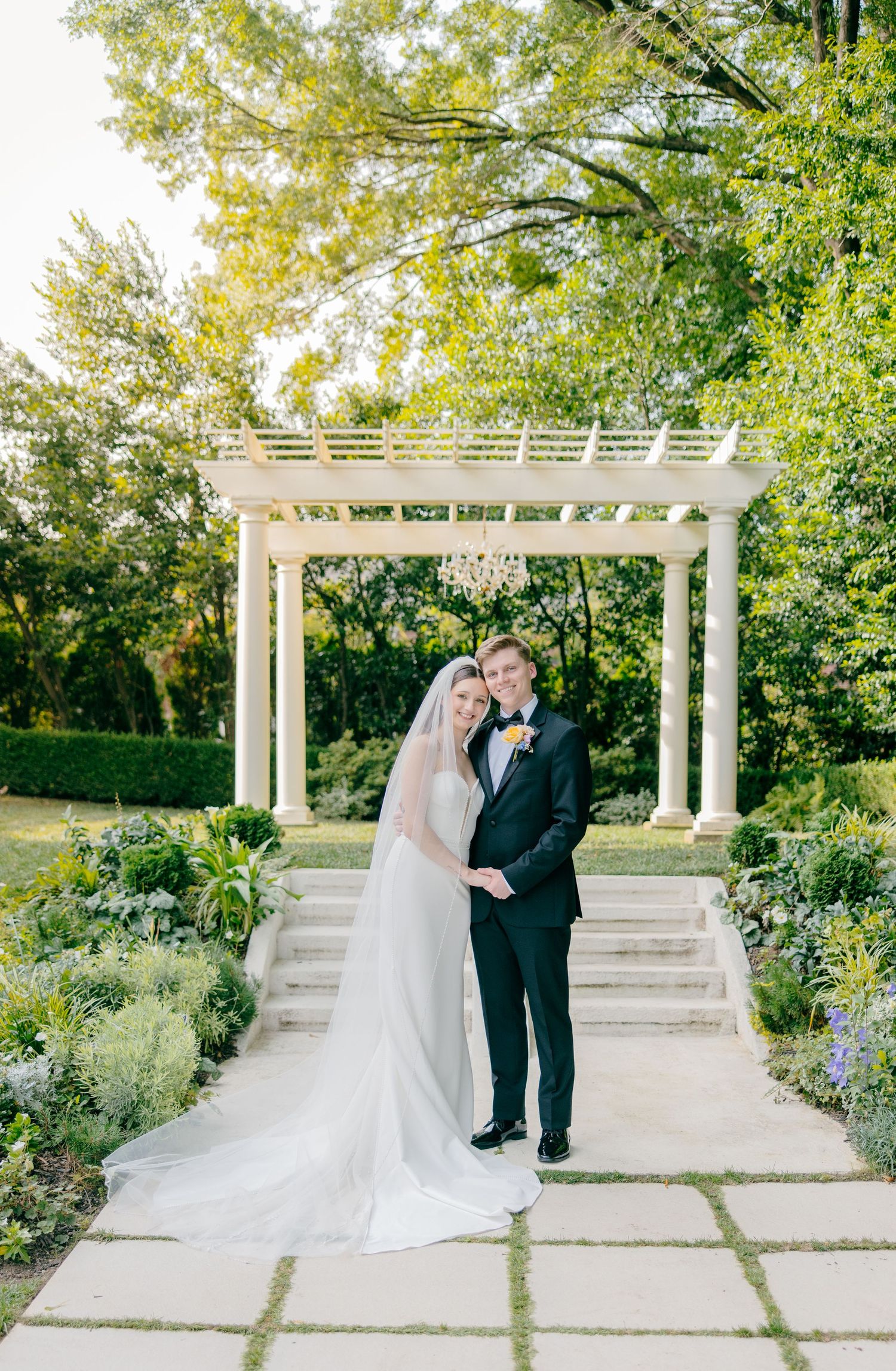 Wedding ceremony sequence under a white pergola in a lush garden setting.