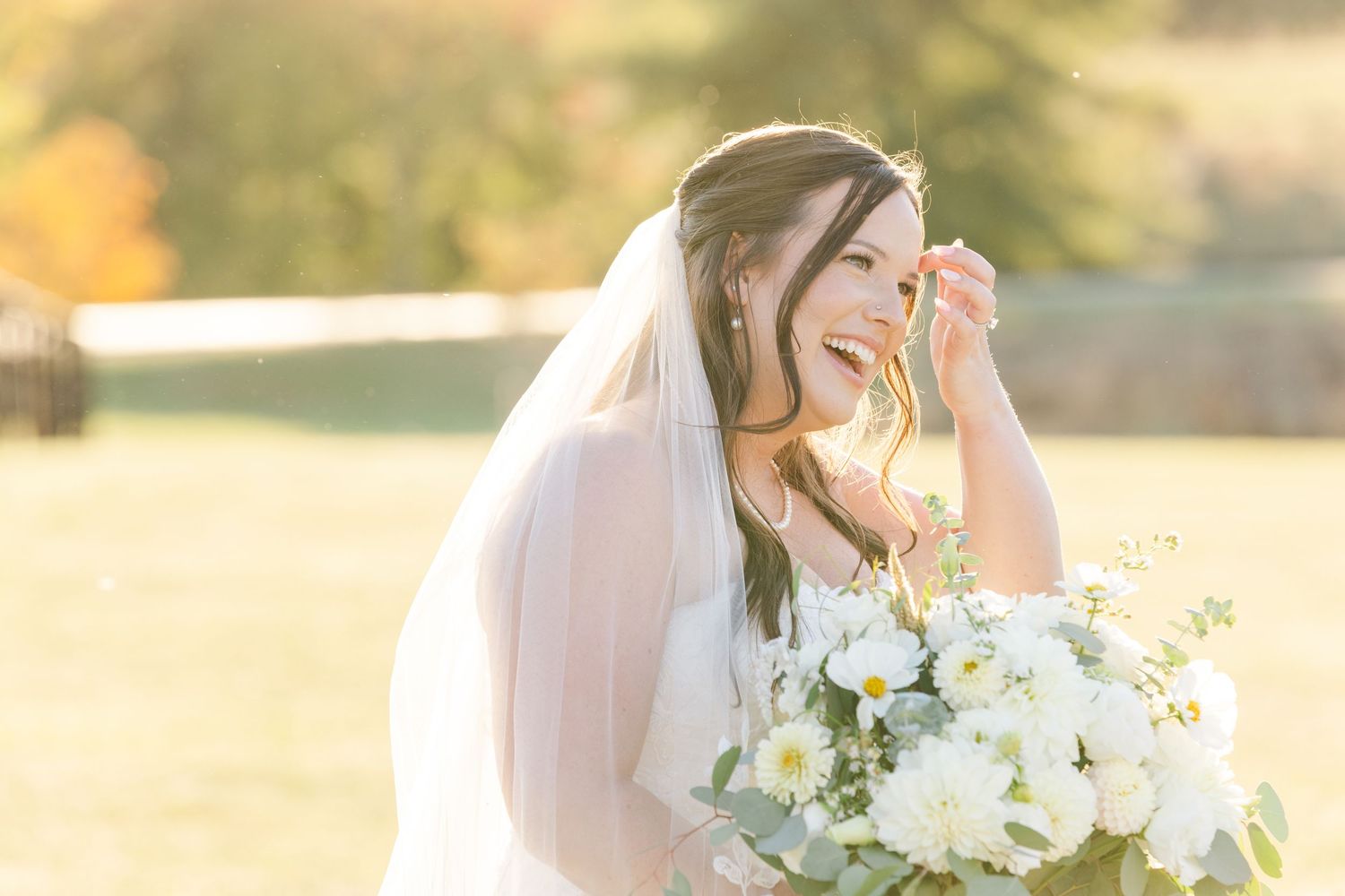 Candid bridal portraits with white bouquet in warm afternoon sunlight.