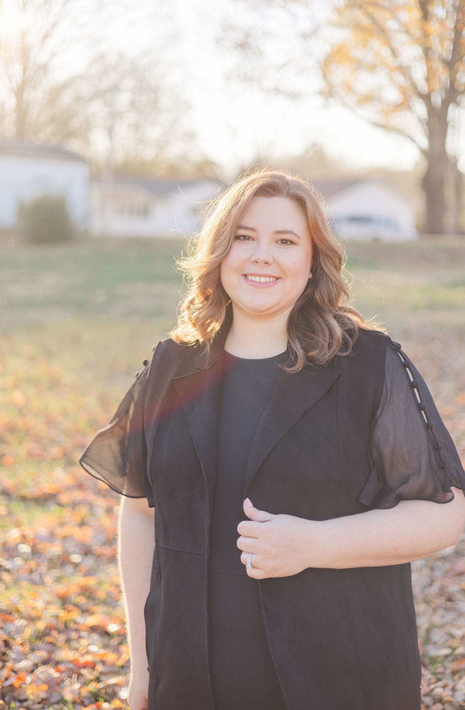 Portrait series in autumn setting with fall leaves and natural lighting.