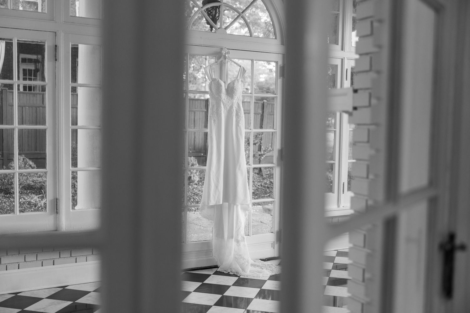 Interior architectural detail of wedding venue with classic windows and columns.