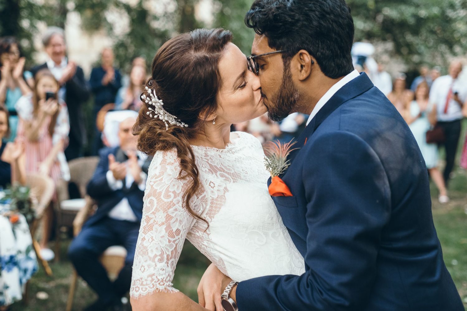 Romantic wedding ceremony moments shared in a beautiful outdoor garden setting.
