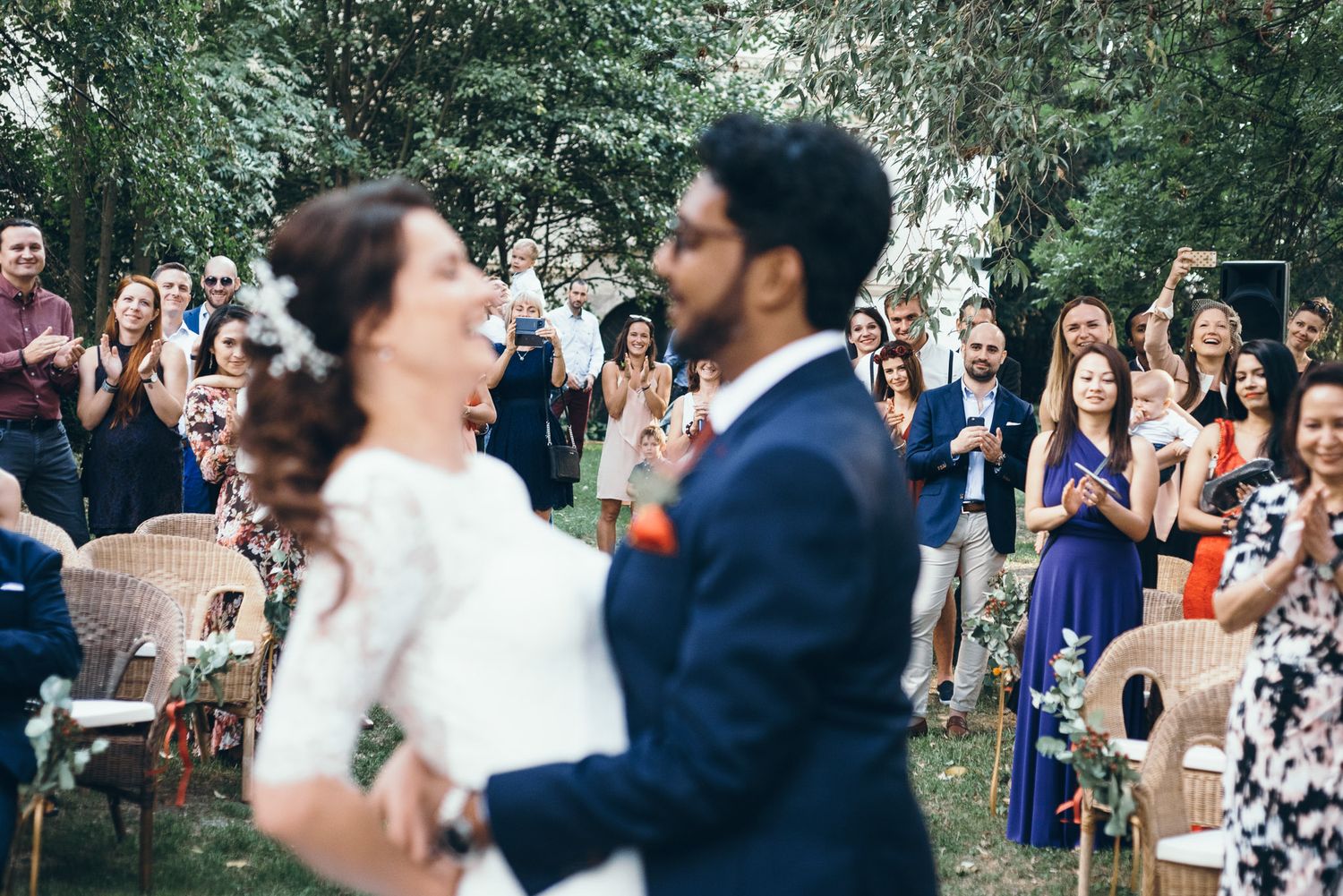 Joyful celebration moments captured during an outdoor wedding reception.