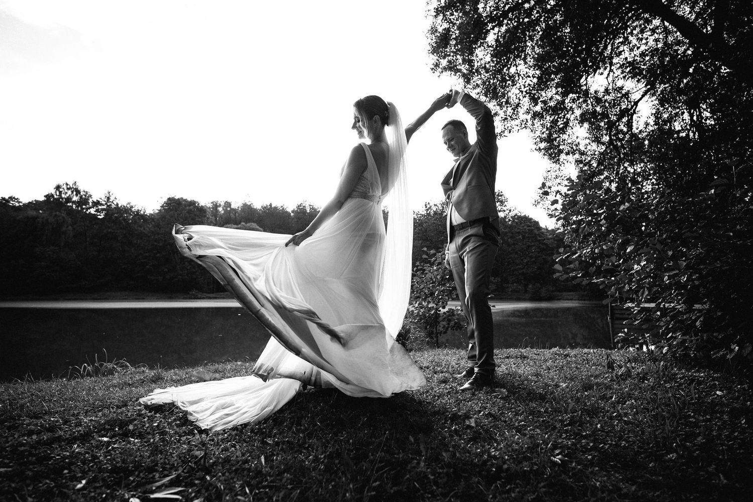 Artistic black and white wedding photography sequence showing silhouettes against natural backdrop.