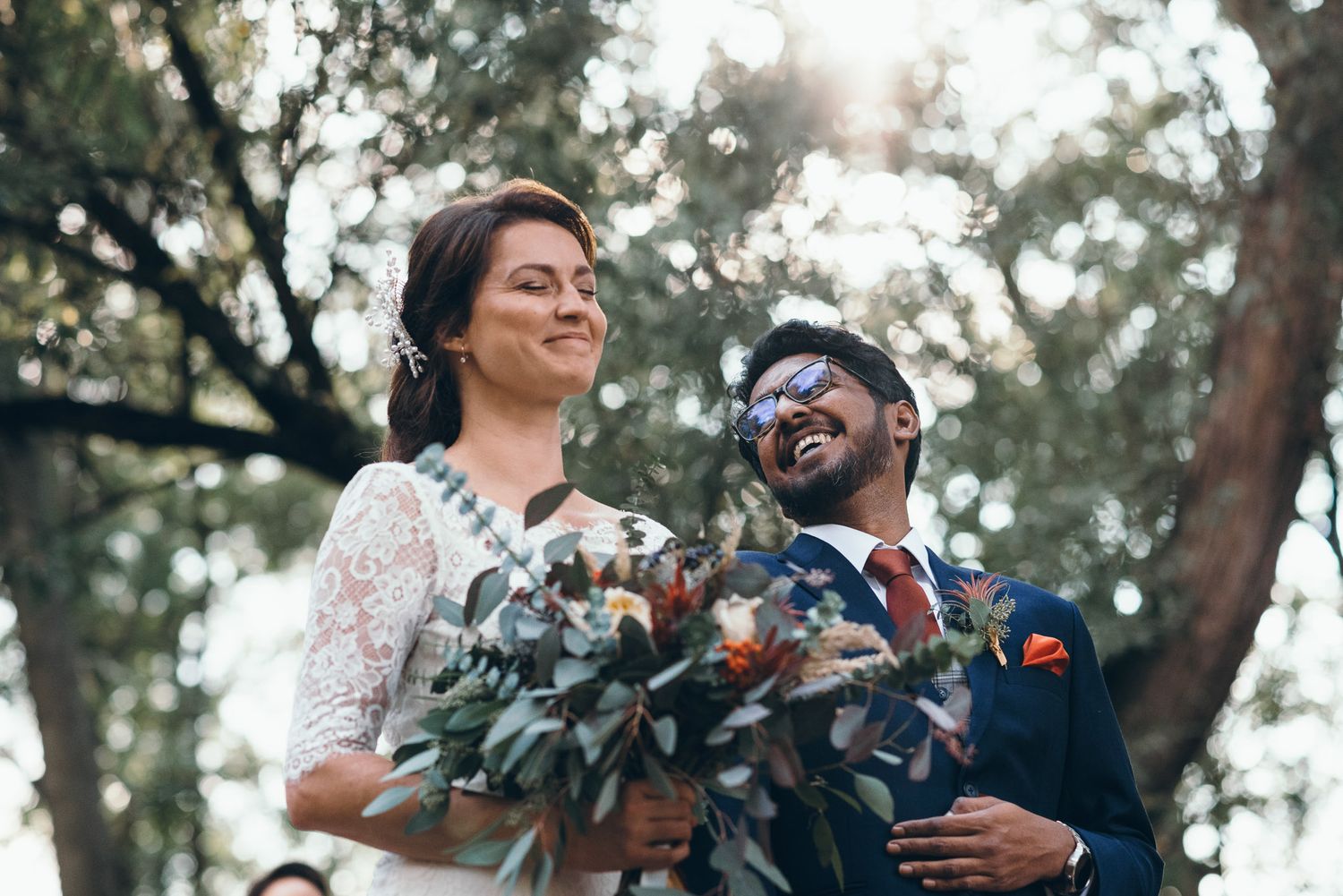 Candid moments of celebration during an outdoor garden wedding.