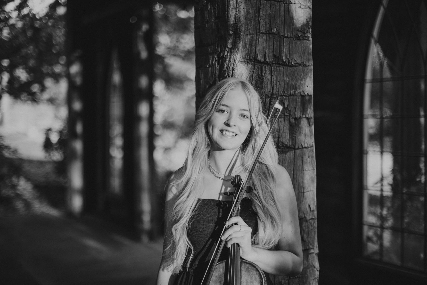 senior photos at Finley Farms holding violin in black and white
