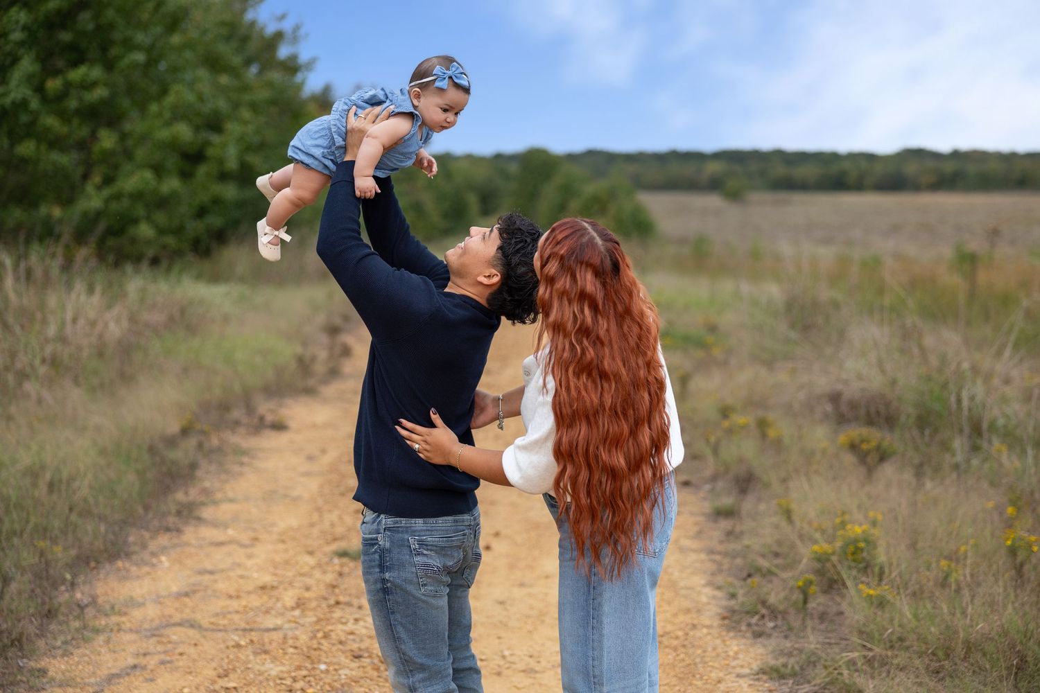 Family portrait series taken outdoors featuring candid interactions against nature backdrop.