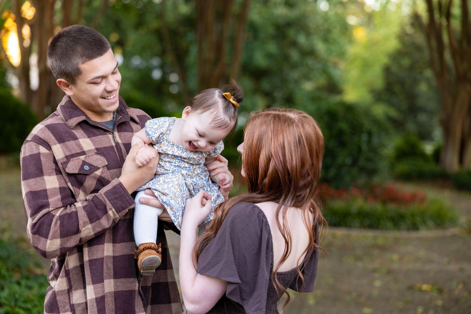 A family sharing joyful moments together outdoors.